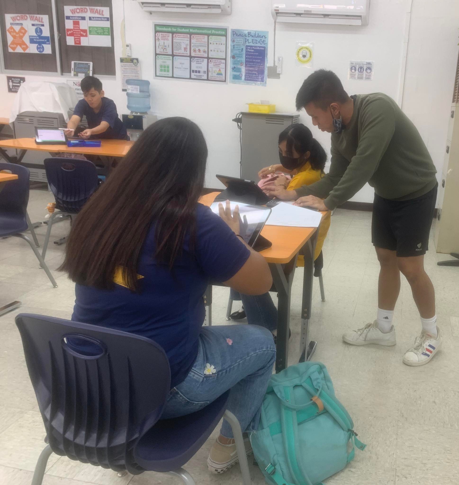  Tutor Richard Waldo, right, and a student.