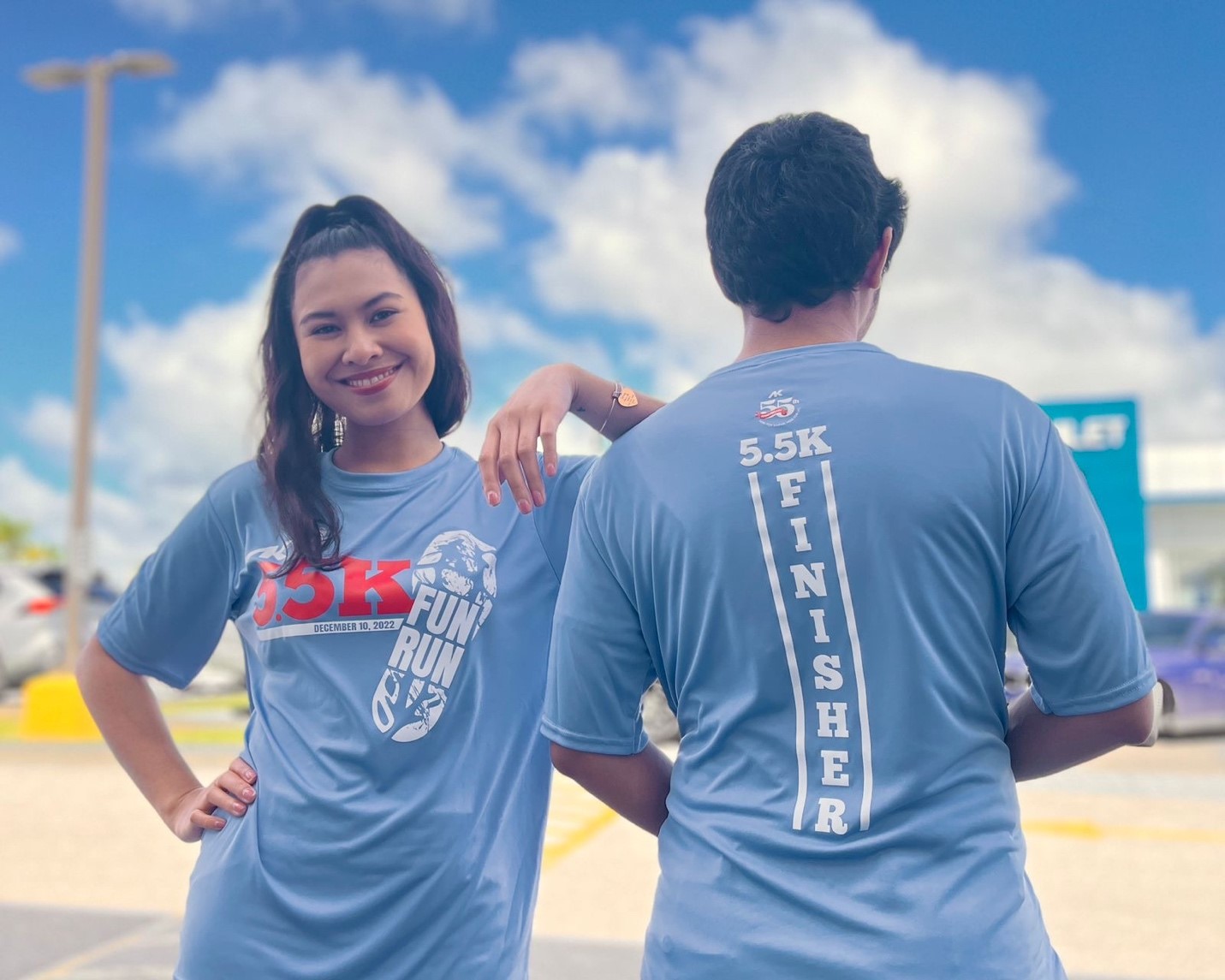 Runners pose in the “finisher shirts” that will be available to those who complete the Run Saipan Holiday Half Marathon and 5.5K Fun Run this Saturday.