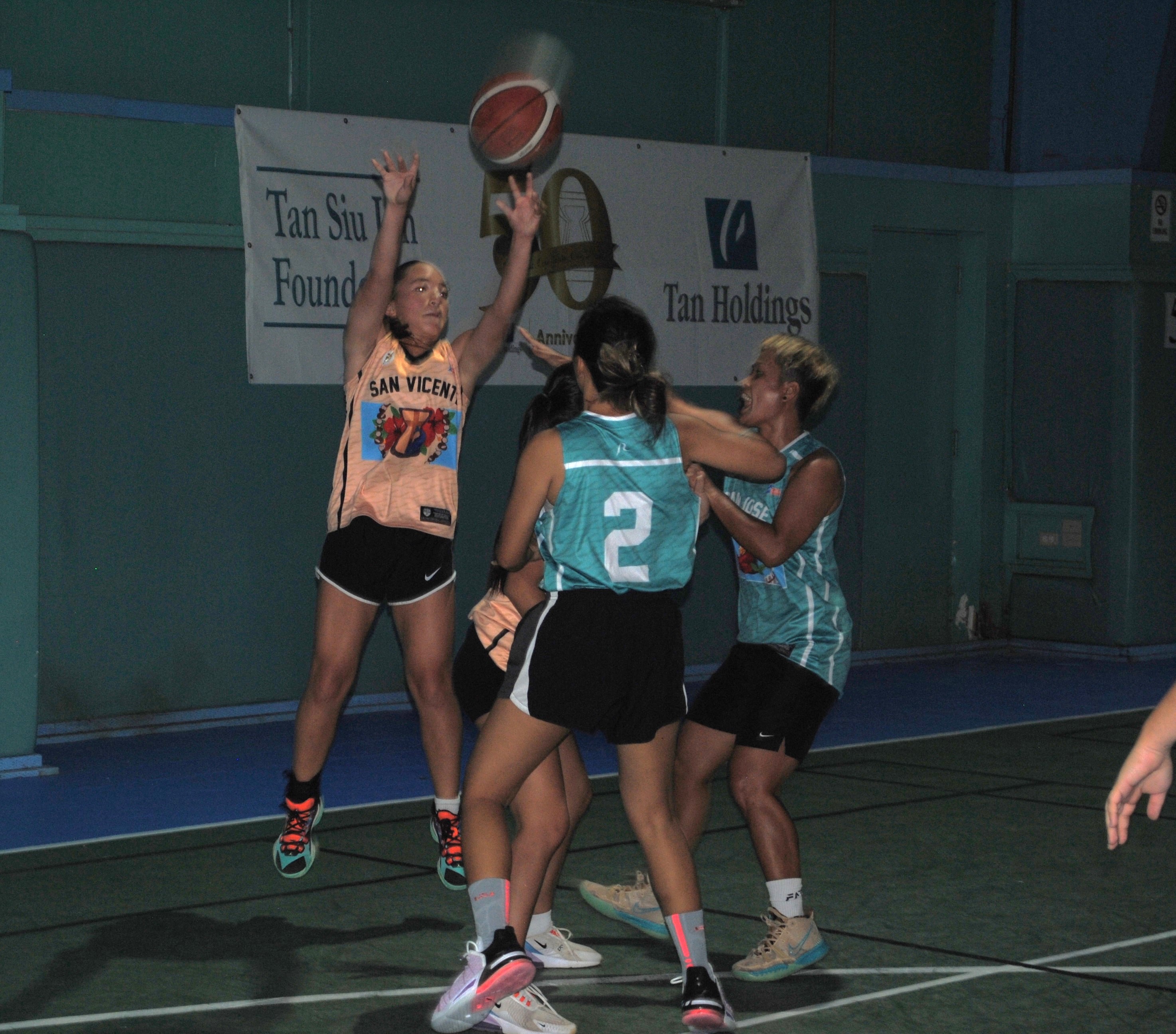 San Vicente's Destiny Pangelinan takes the contested three-point shot during a women's division game of the 2022 Marianas Village Pride Basketball League Saturday at the TSL Sports Complex.