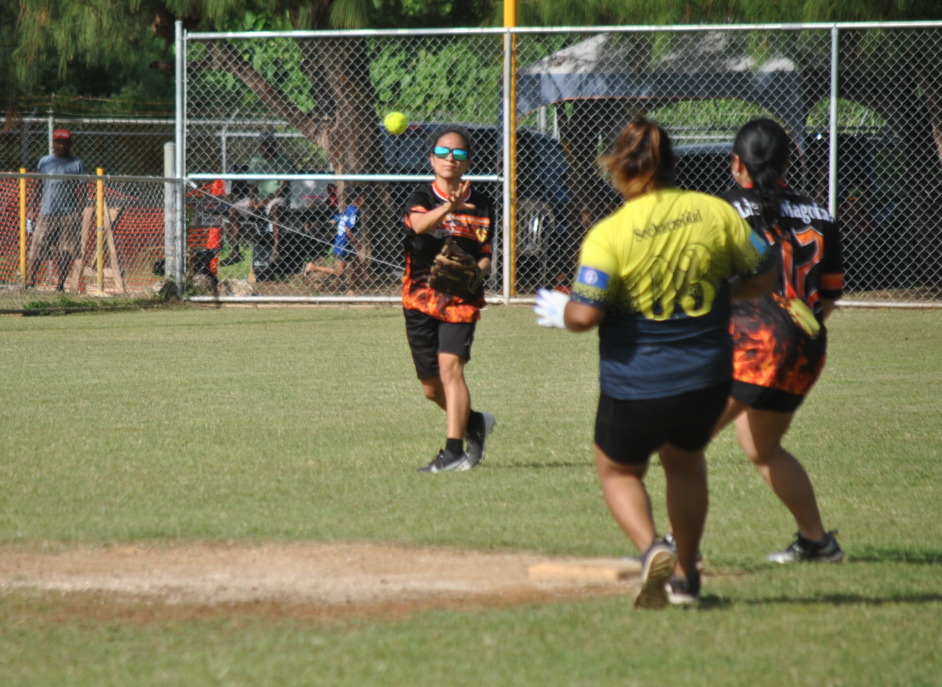 Hotshots shortstop Erica Tenorio throws to second baseman Magofna for the out during a semifinal game in the ladies division of the 2022 Budweiser Belau Amateur Softball League Sunday at the Dandan baseball field.