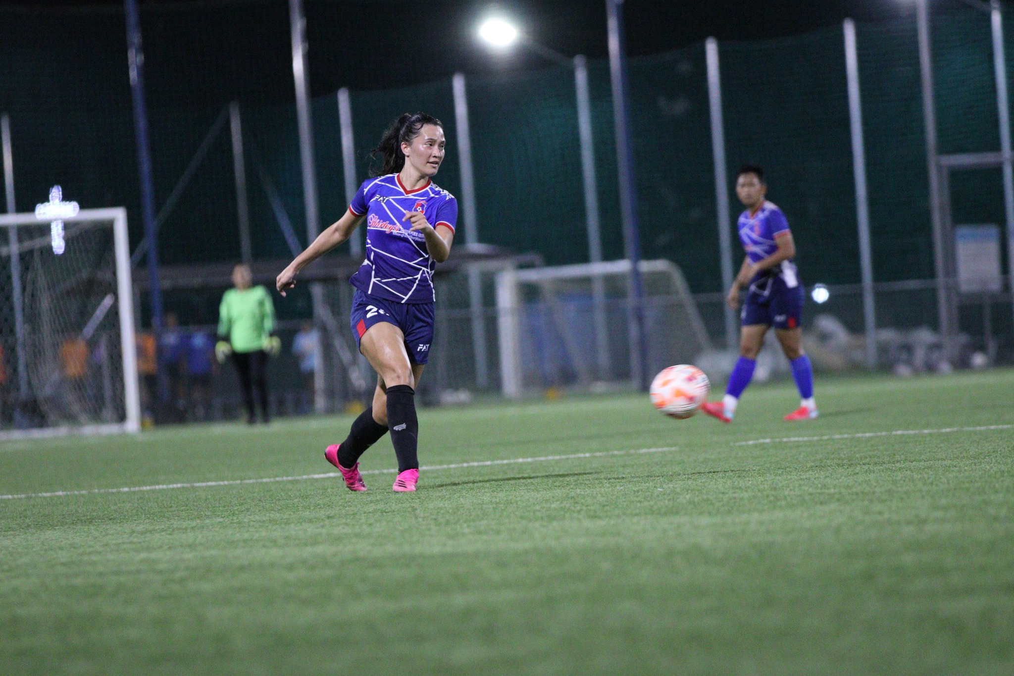 Shirley’s Bernadette Horey pushes the balls  during a Premier Division game of the Dove Women's League at the NMI Soccer Training Center.