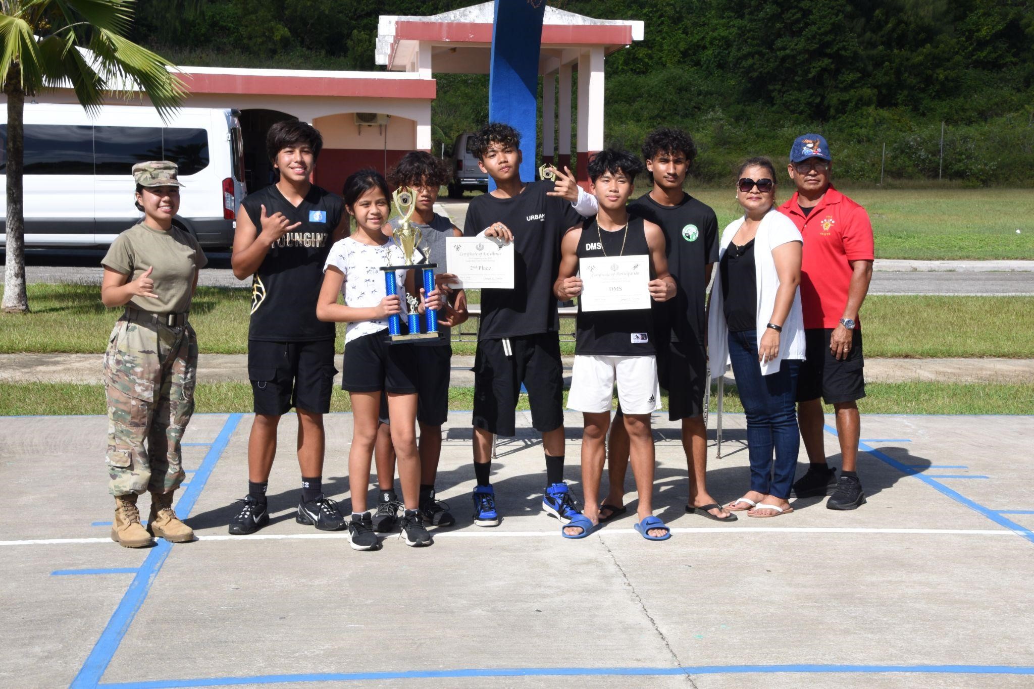 Dandan Middle School poses with their trophy after winning 2nd place in the competition.