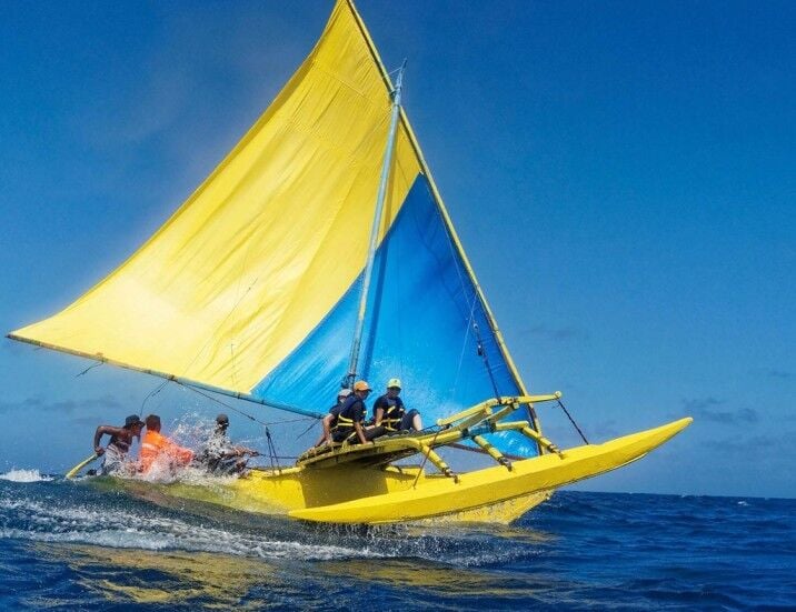 A canoe's outrigger lifts out of the water in a stiff breeze in Jaluit Atoll in the Marshall Islands in this photo taken by photojournalist Floyd K. Takeuchi in the late 2010s.
