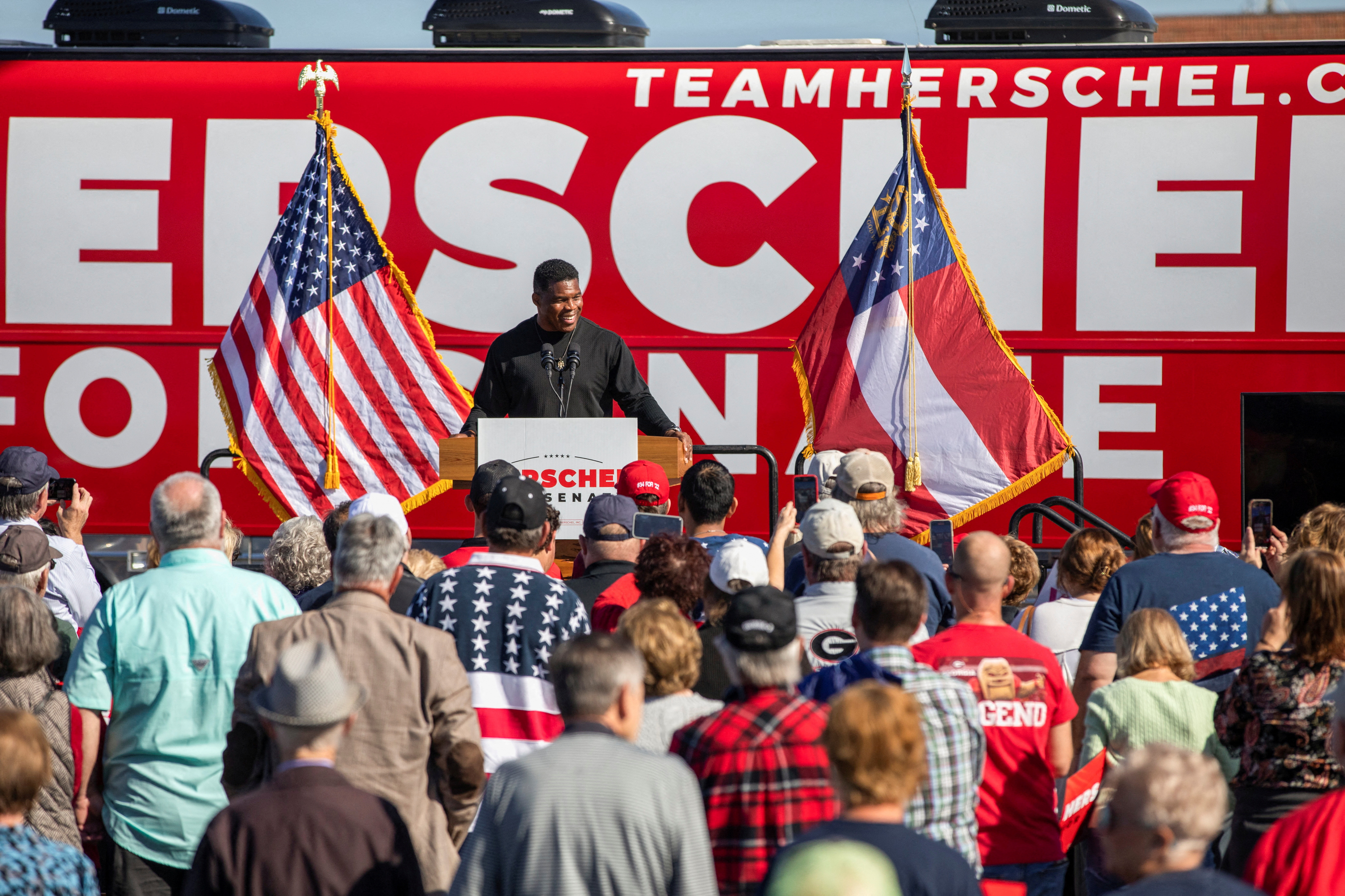 Republican U.S. Senate candidate and former football player Herschel Walker speaks during an event ahead of the runoff election in Warner Robins, Georgia,  Dec. 2, 2022.