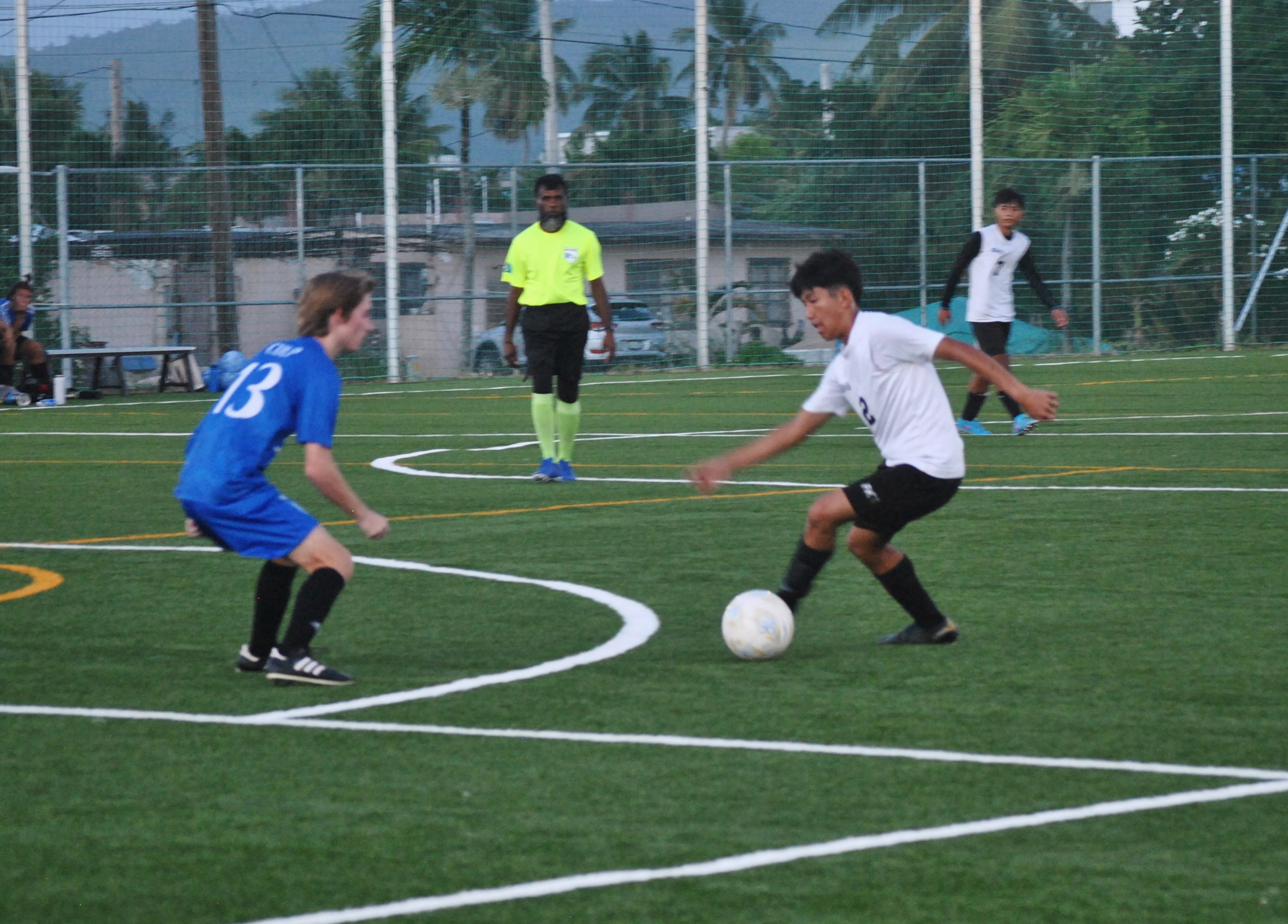SSHS's Monico Claridades attempts to shake off a defender during a semifinal match in the boys high school division of the NMIFA-PSS Interscholastic Soccer League Wednesday at the NMI Soccer Training Center.