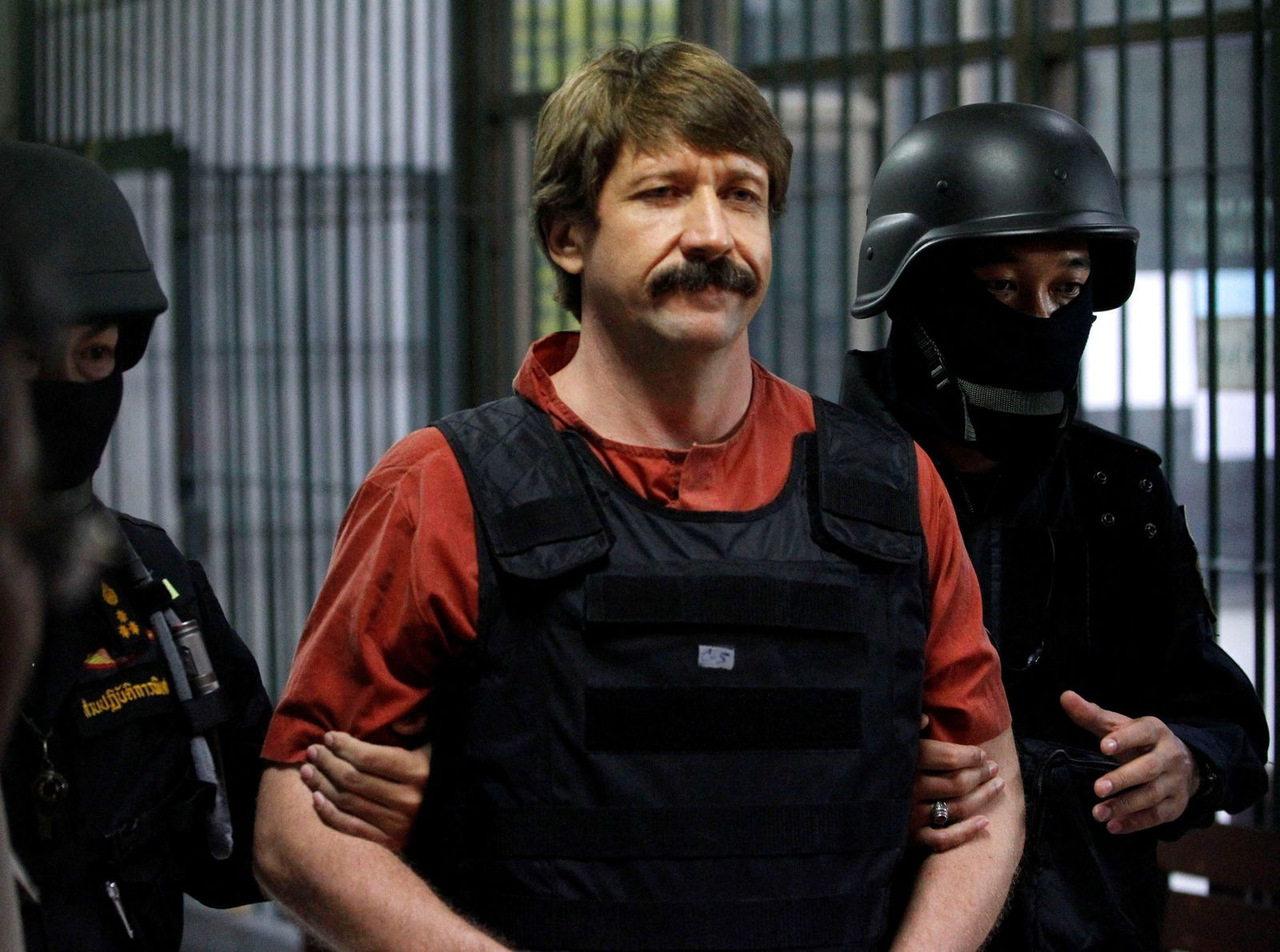 Russian arms dealer Viktor Bout is escorted by members of a special police unit after a hearing at a criminal court in Bangkok on Oct. 5, 2010.