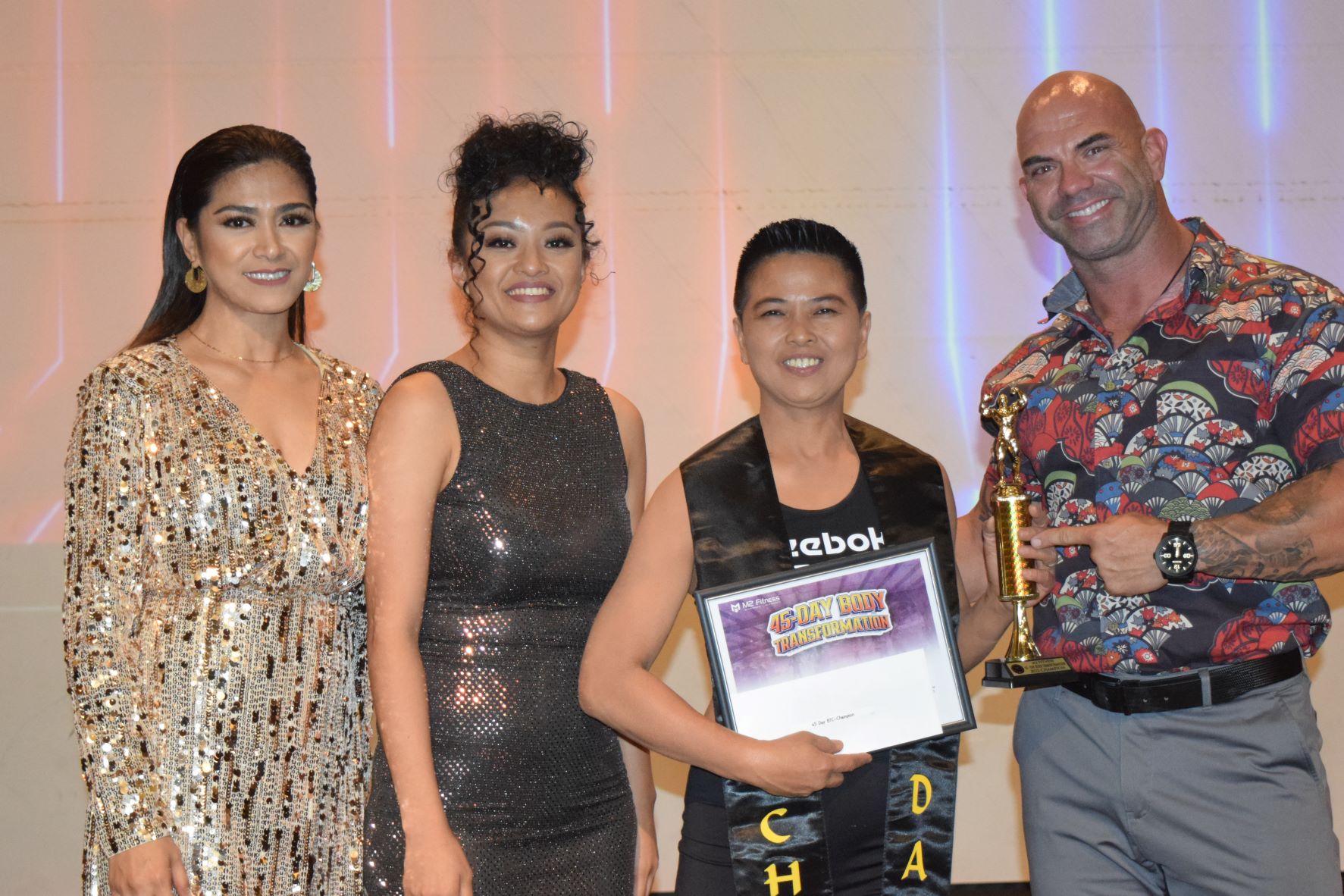 M2 Fitness 45-day transformation challenge champion Irene Cristobal, second right, with M2 co-founders Mary Grace Bautista, left, and Mita Pelicano, second left, and Latte Built owner Derek Cutting, one of the competition judges.