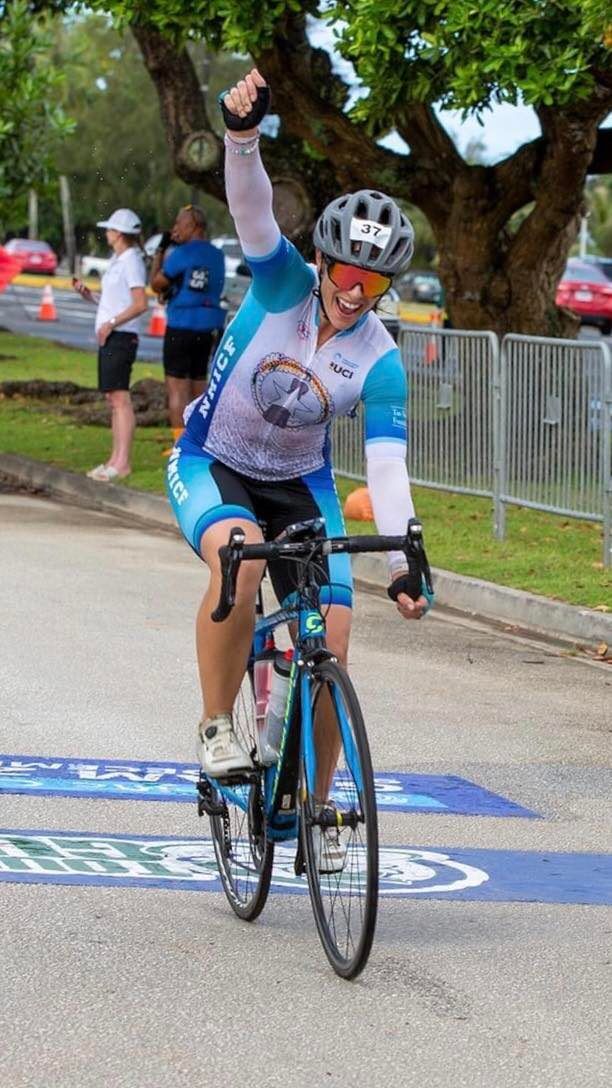 The NMI's Robyn Spaeth celebrates after completing the 2022 Tour of Guam/Pacific Cup Sunday on Guam.