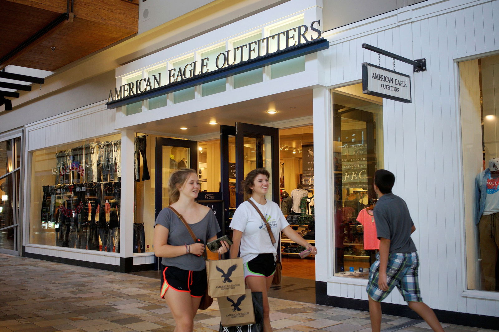 Shoppers leave the American Eagle Outfitters store in Broomfield, Colorado on Aug. 20, 2014.
