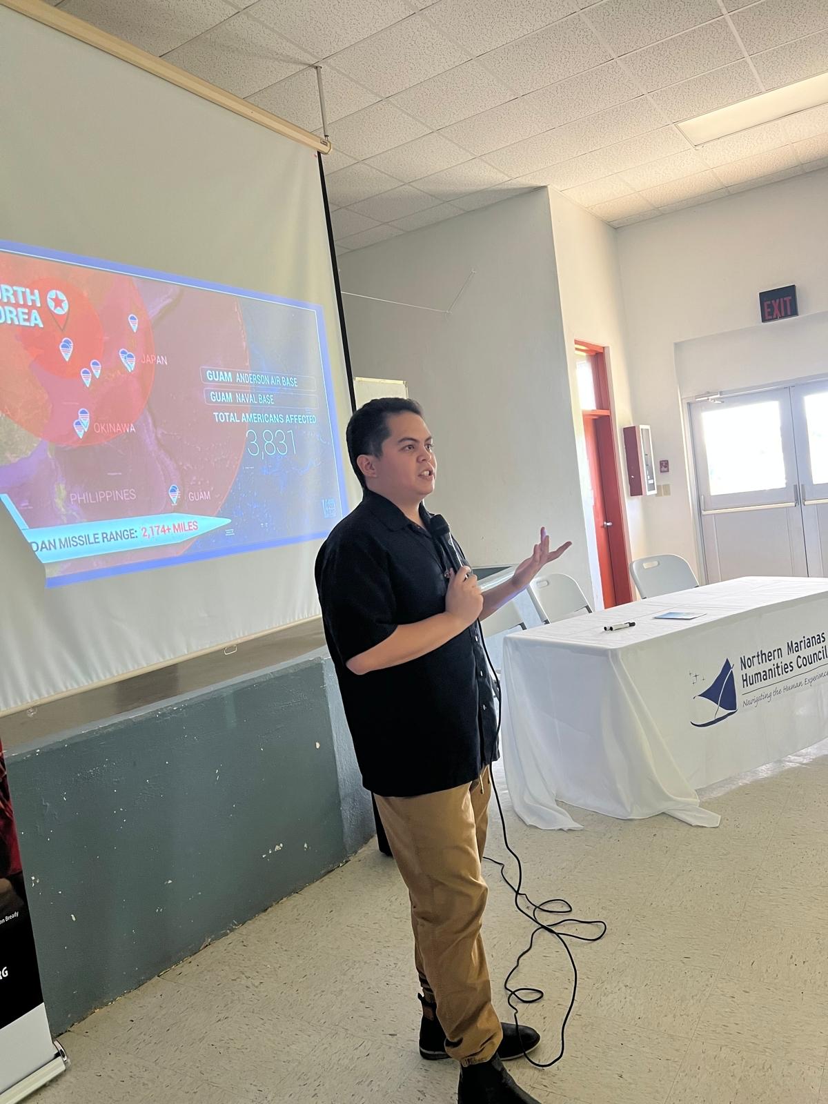 Rota native and KUAM News regional correspondent Thomas Manglona II gives a presentation on media ethics to journalism students, juniors, and seniors at Dr. Rita H. Inos Jr./Sr. High School.