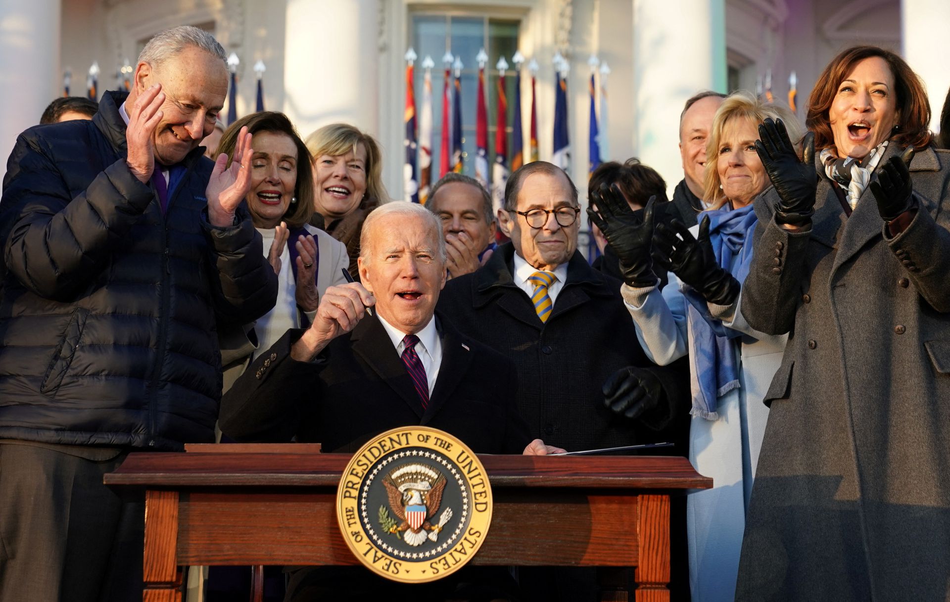 President Joe Biden celebrates with Senate Majority Leader Chuck Schumer, House Speaker Nancy Pelosi, U.S. Sen. Tammy Baldwin, Rep. Jerry Nadler, first lady Jill Biden and Vice President Kamala Harris after signing the "Respect for Marriage Act," a landmark bill protecting same-sex marriage, on the South Lawn at the White House in Washington, D.C., Dec. 13, 2022.