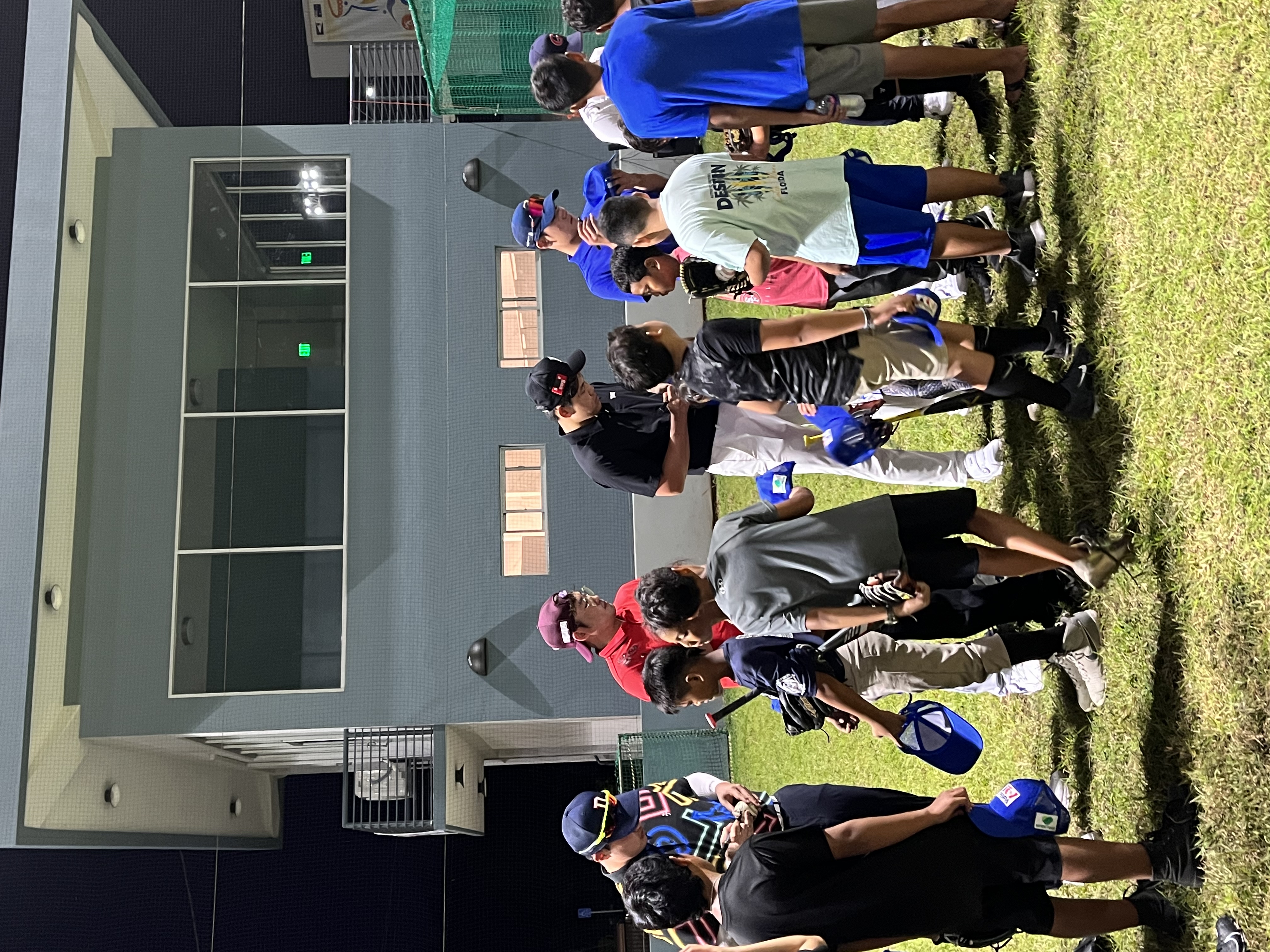Professional baseball players of South Korea sign autographs after a training clinic for nearly 50 players of the CNMI Little League at the Oleai Sports Complex in Saipan on Dec. 14, 2022. The players are in the Marianas as a part of a media filming project of the Marianas Visitors Authority in cooperation with MBC TV.