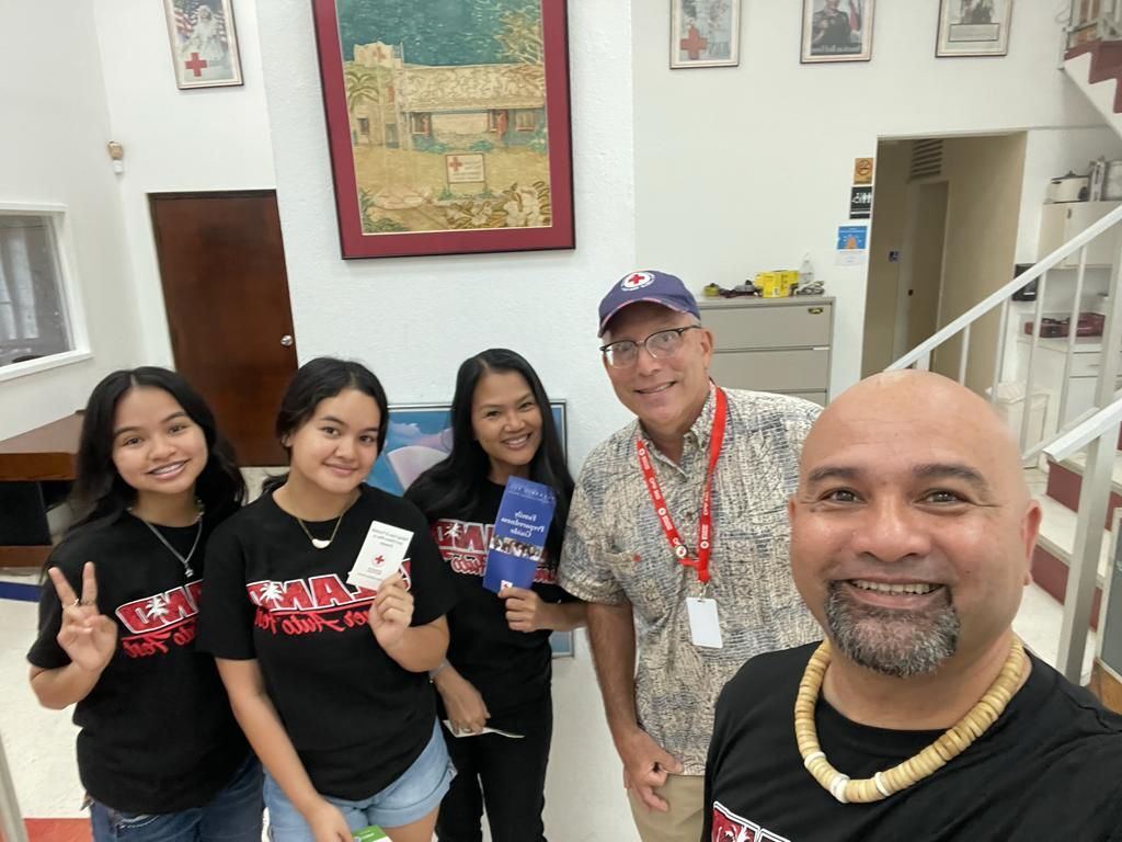 In photo: Island Summer Auto Fest officers James, Carol, Mia and Melia Fleming with John Hirsh, executive director for the American Red Cross-NMI Chapter.