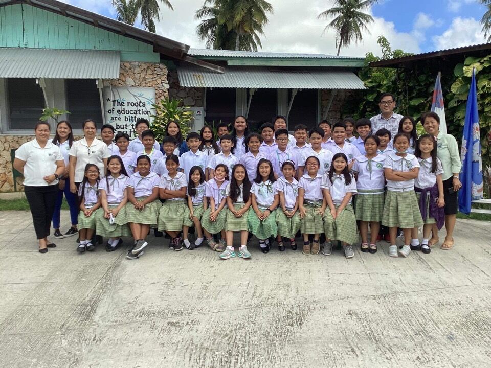 Green Meadow School students who participated in the grades 3-5 category of the Primary Grade Forensic Conference pose for a photo with their teachers and school officials.