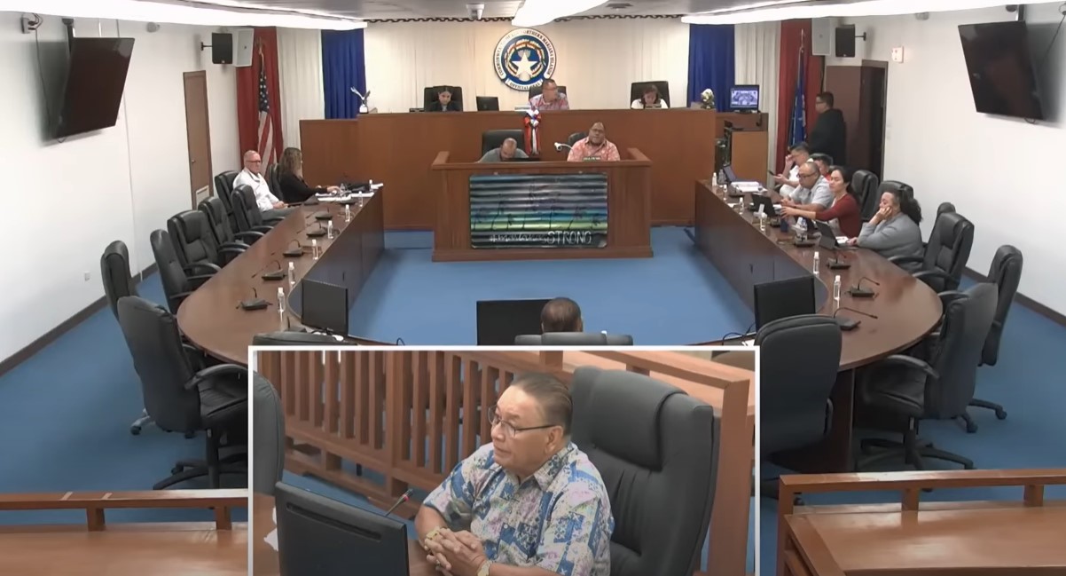 Commerce Secretary Edward "Tofila" M. Deleon Guerrero, center inset, appears before a House joint panel in the House chamber on Friday.