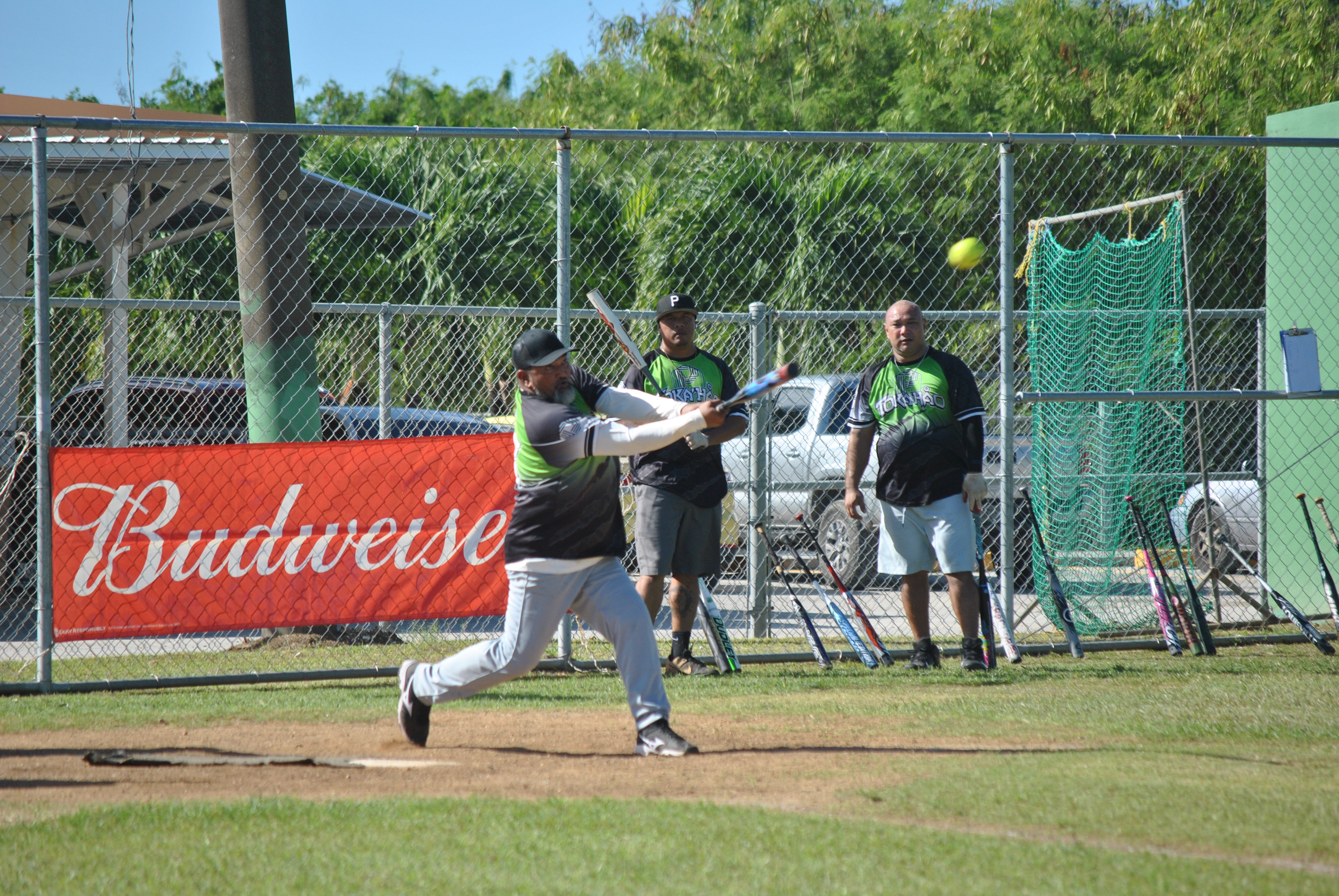 Takohao's George David connects a double during a men's division game of the 2022 Budweiser Belau Amateur Softball League at the Dandan baseball field.