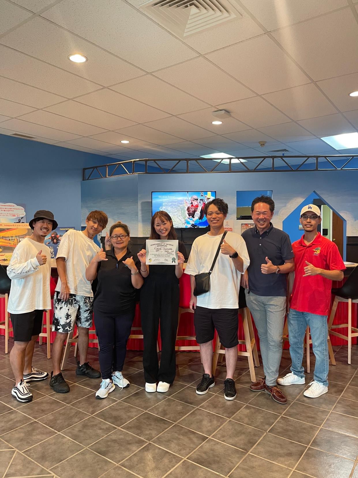 Participants in the familiarization tour organized by the Marianas Visitors Authority for Japan’s UUUM Golf YouTube channel celebrate their skydiving tour at Skydive Saipan in The Marianas on Nov. 18, 2022.