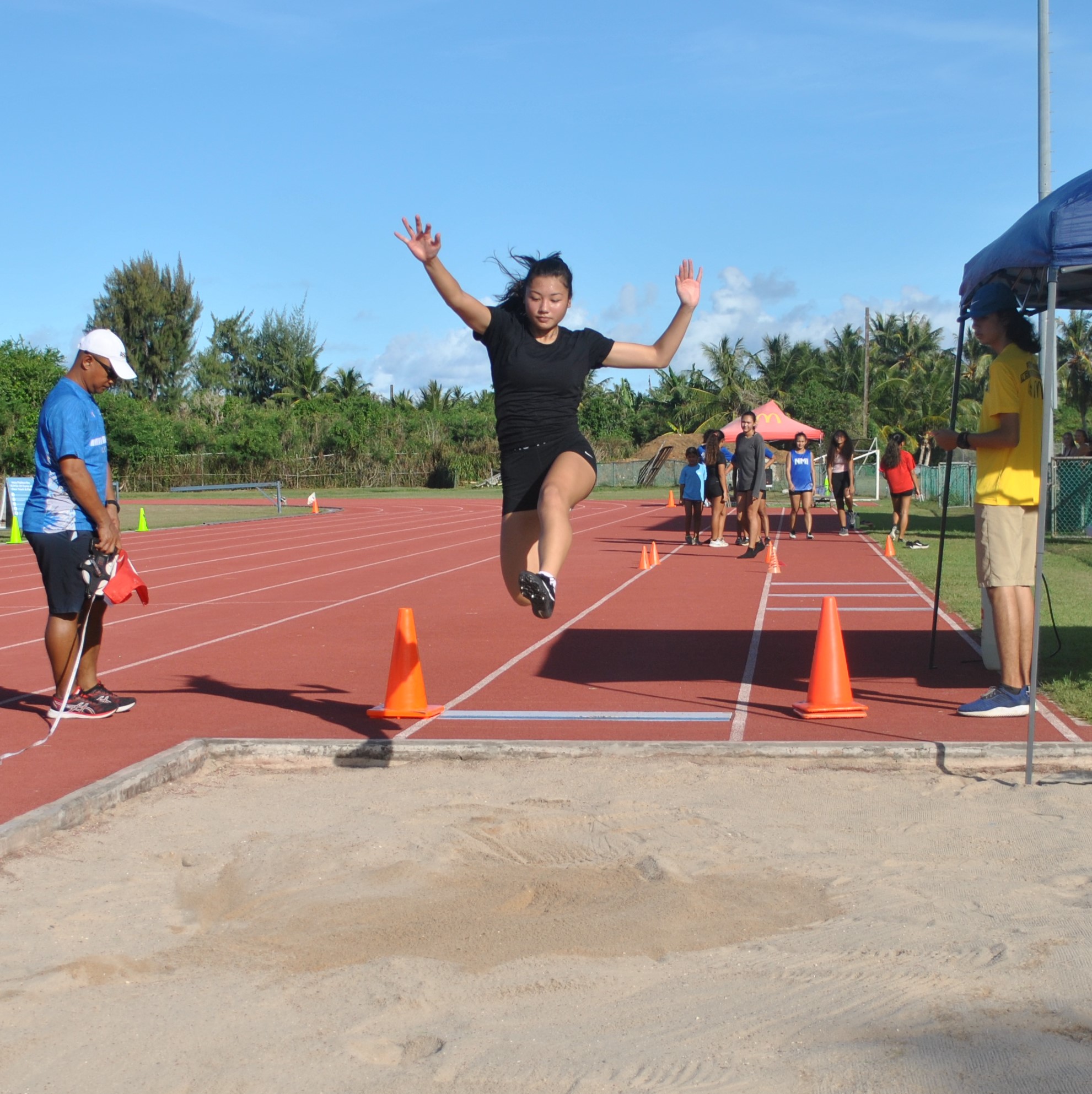 Leani Acosta executes the long jump to lead the women's U18 division during the NMA Track & Field Open Meet last year at the Oleai Sports Complex.