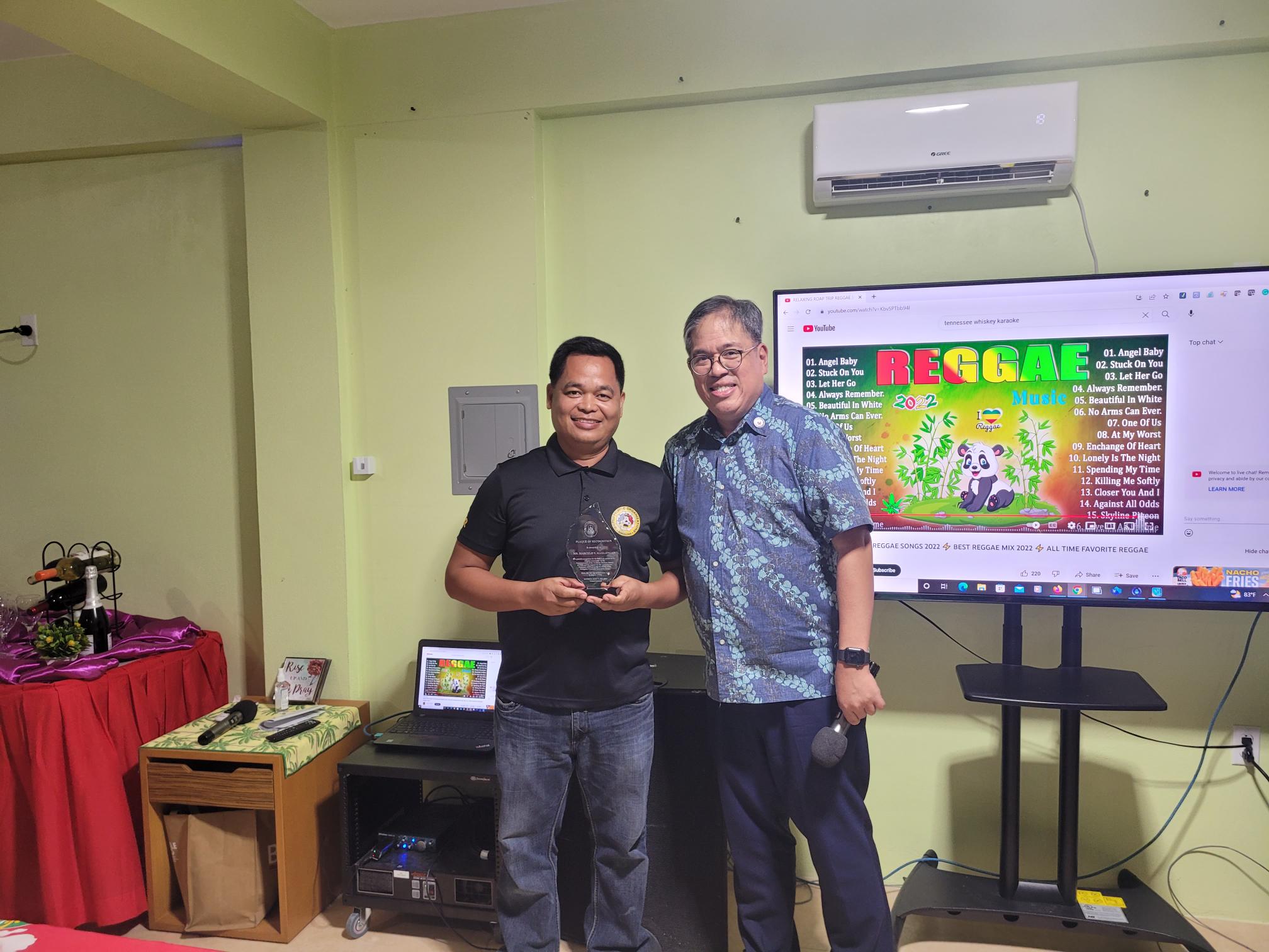 Philippine Consul General to Guam Patrick John U. Hilado poses for a photo with outgoing United Filipino Organization President Marcelo Masilungan who received a plaque of recognition for serving the Filipino community in the CNMI. 