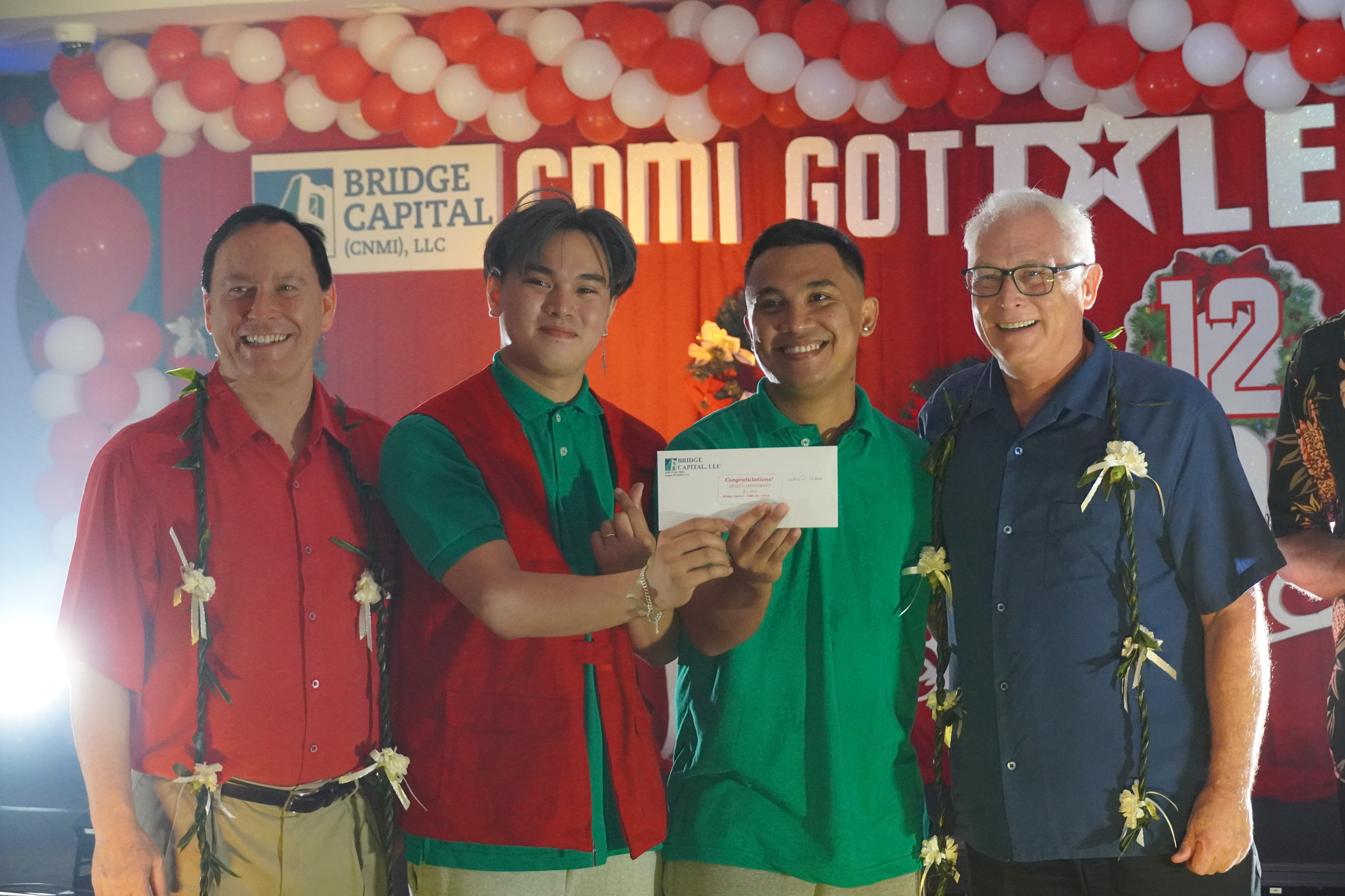 From left, Shawn Scott, Cire Durano, Joel Balagon, and John Baldwin pose for a photo. Durano and Balagon are "Cookies and Cream," the 2022 CNMI Got Talent champions in the adults category. They also won the Most Christmas-y Award. The annual talent contest is hosted by Bridge Capital LLC, owned by Scott and Baldwin
