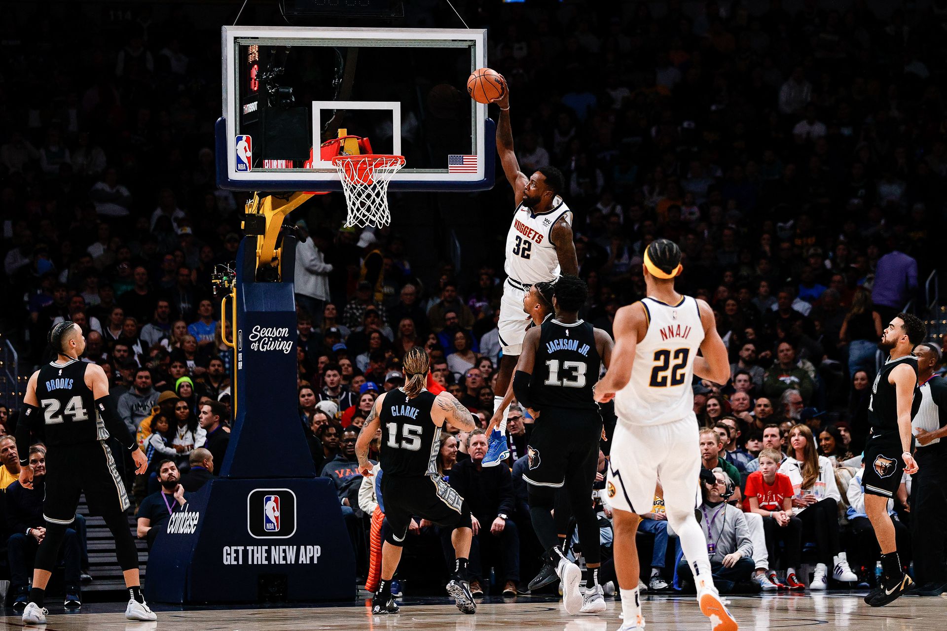 Denver Nuggets forward Jeff Green (32) dunks the ball against Memphis Grizzlies forward Jaren Jackson Jr. (13) and guard Ja Morant (12) and forward Brandon Clarke (15) as forward Zeke Nnaji (22) looks on in the second quarter at Ball Arena in Denver, Colorado, Dec. 20, 2022.