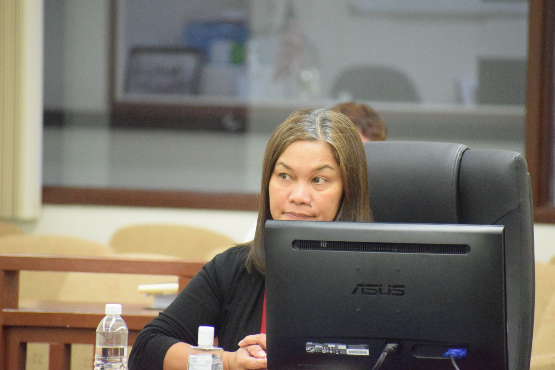 Bank of Saipan loan manager Karen Kalen appears before a House joint committees conducting a public hearing on the Building Optimism, Opportunity, and Stability Together or BOOST program on Thursday in the House chamber.