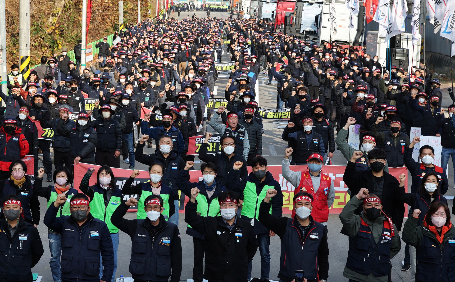 Unionized truckers shout slogans during their rally as they kick off their strike in front of transport hub Uiwang, south of Seoul, South Korea, Nov. 24, 2022.