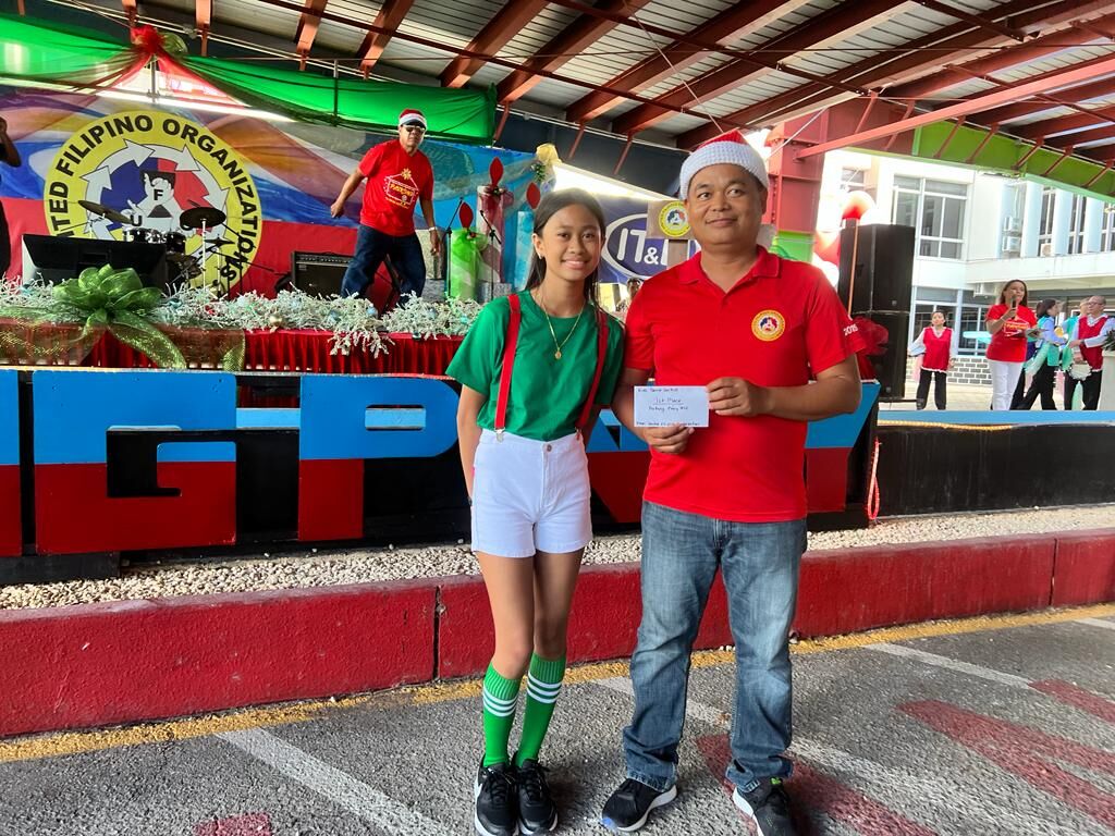 An Uplifted Crew member with United Filipino Organization President Marcelo Masilungan.