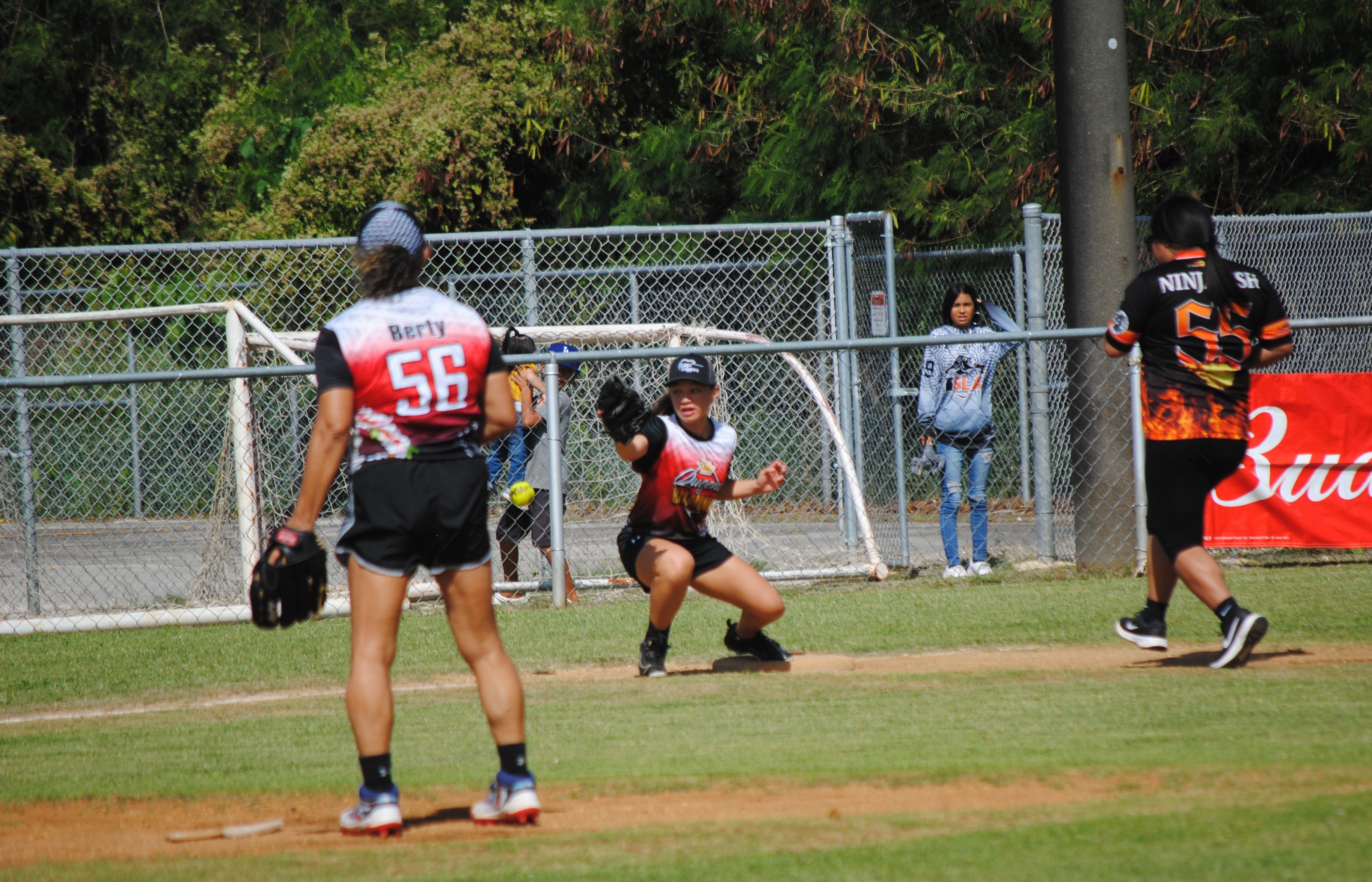 Queens of Diamonds third baseman Destiny Pangelinan extends to catch the throw for the out during the women’s division championship game of the 2022 Budweiser Belau Amateur Softball League Sunday at the Dandan baseball field.