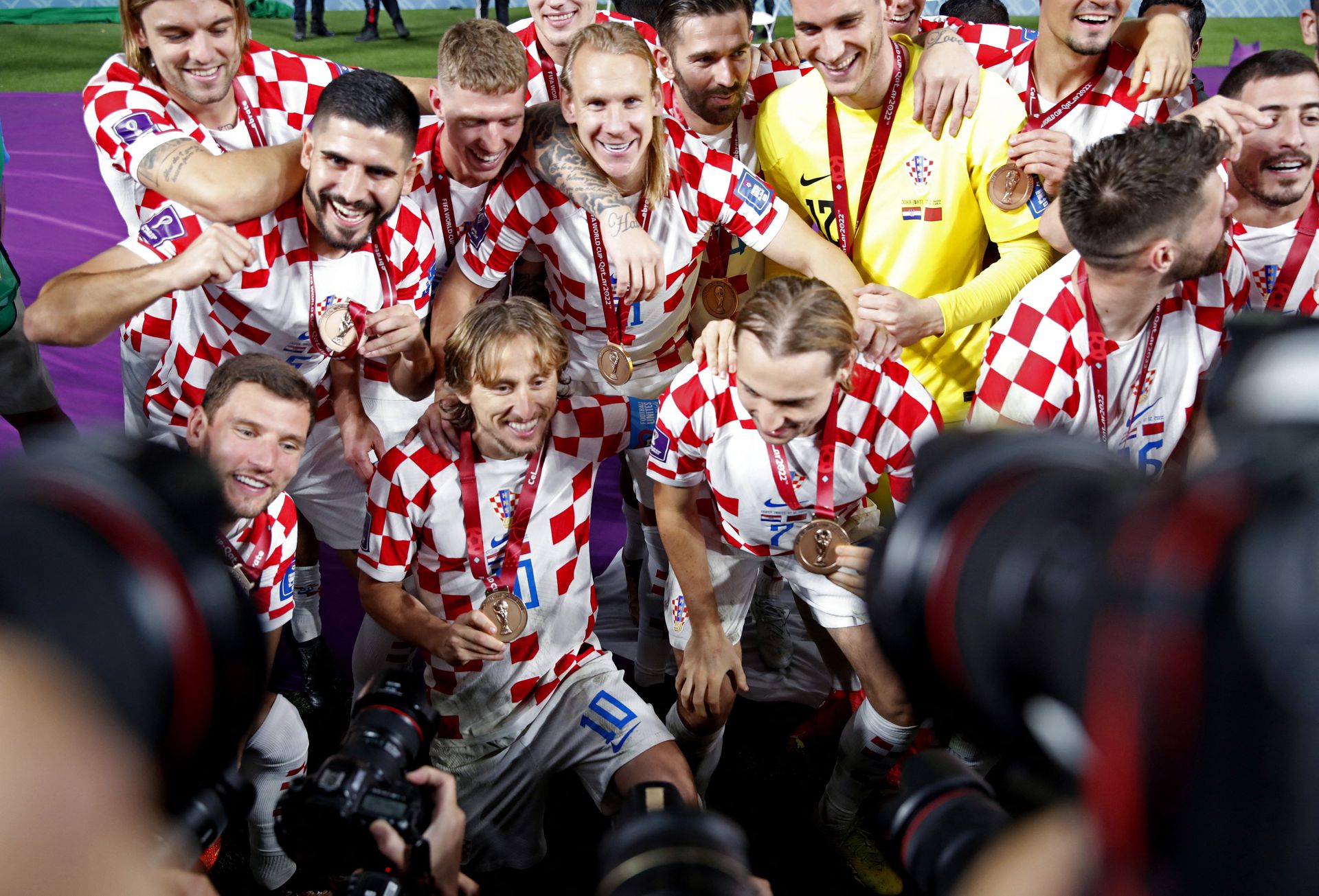 Croatia's Luka Modric and team mates celebrate as they finish in third place after beating Morocco 2-1 at the Khalifa International Stadium in Doha, Qatar on Dec. 17, 2022.