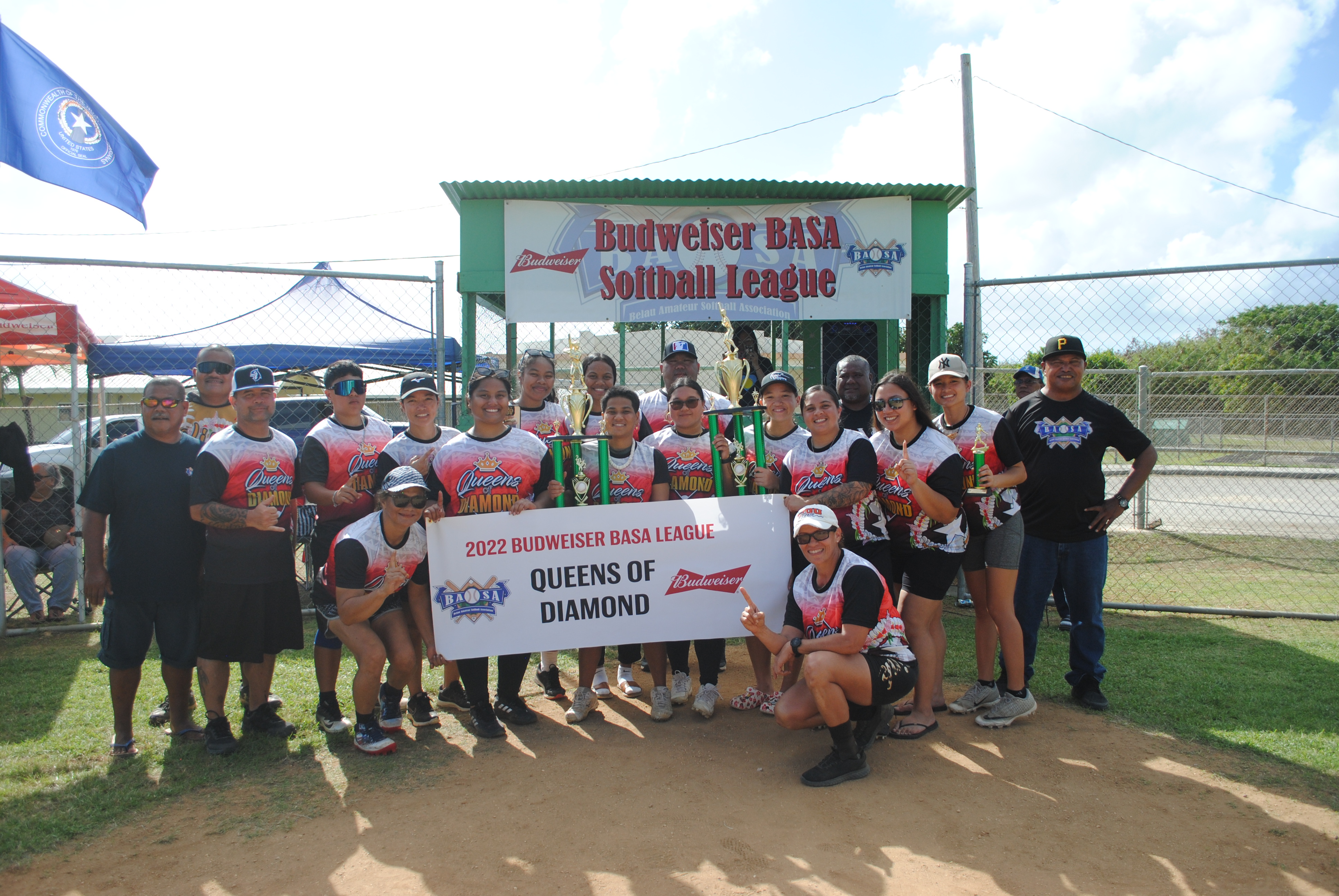 The Queens of Diamonds pose for a photo after winning the women's division title of the 2022 Budweiser Belau Amateur Softball League on Sunday at the Dandan baseball field.