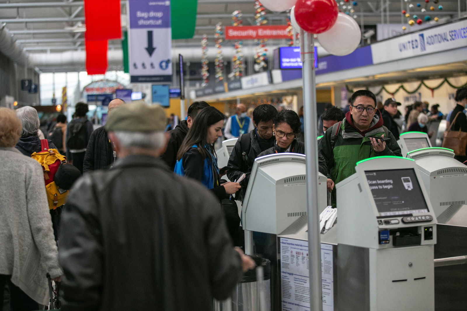 Passengers wait for the resumption of flights at O'Hare International Airport after the Federal Aviation Administration had ordered airlines to pause all domestic departures due to a system outage, in Chicago, Illinois, Jan. 11, 2023.