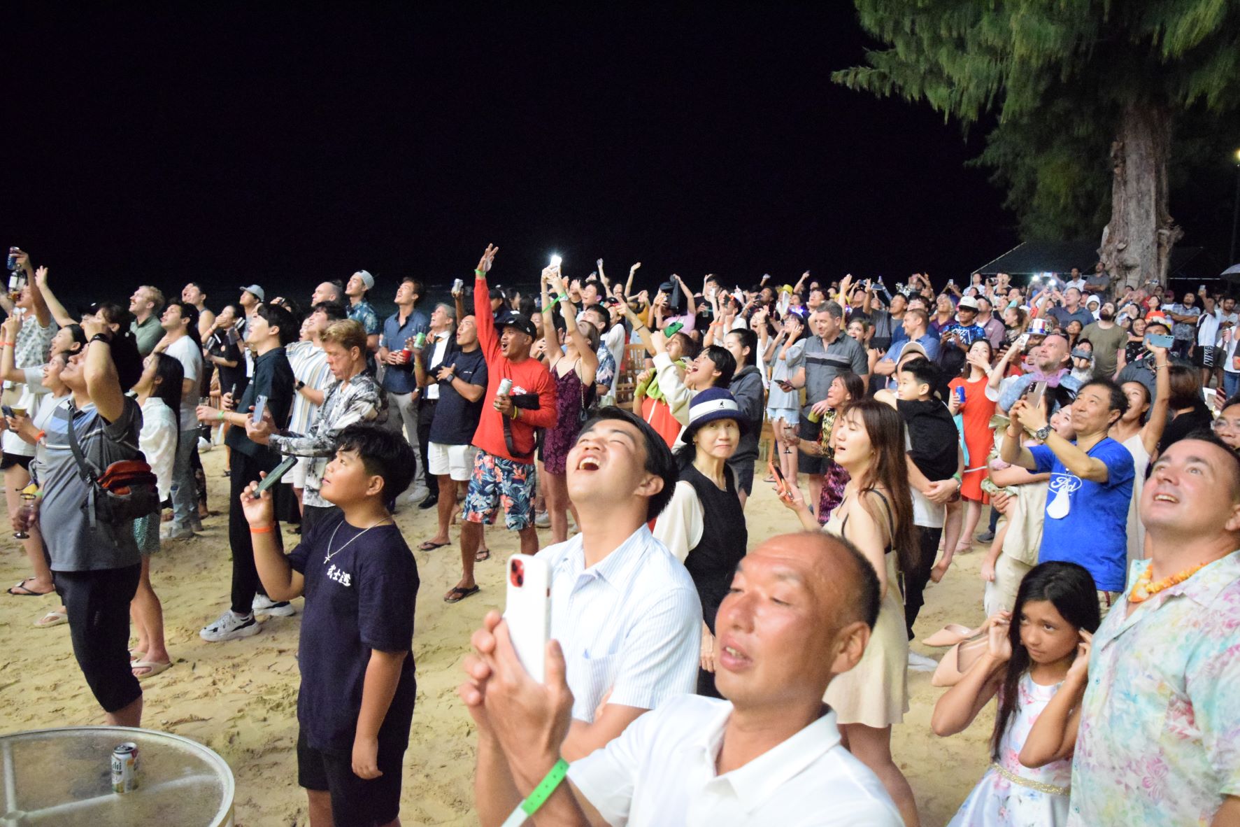 Guests witness the firework display at the Hyatt beach.