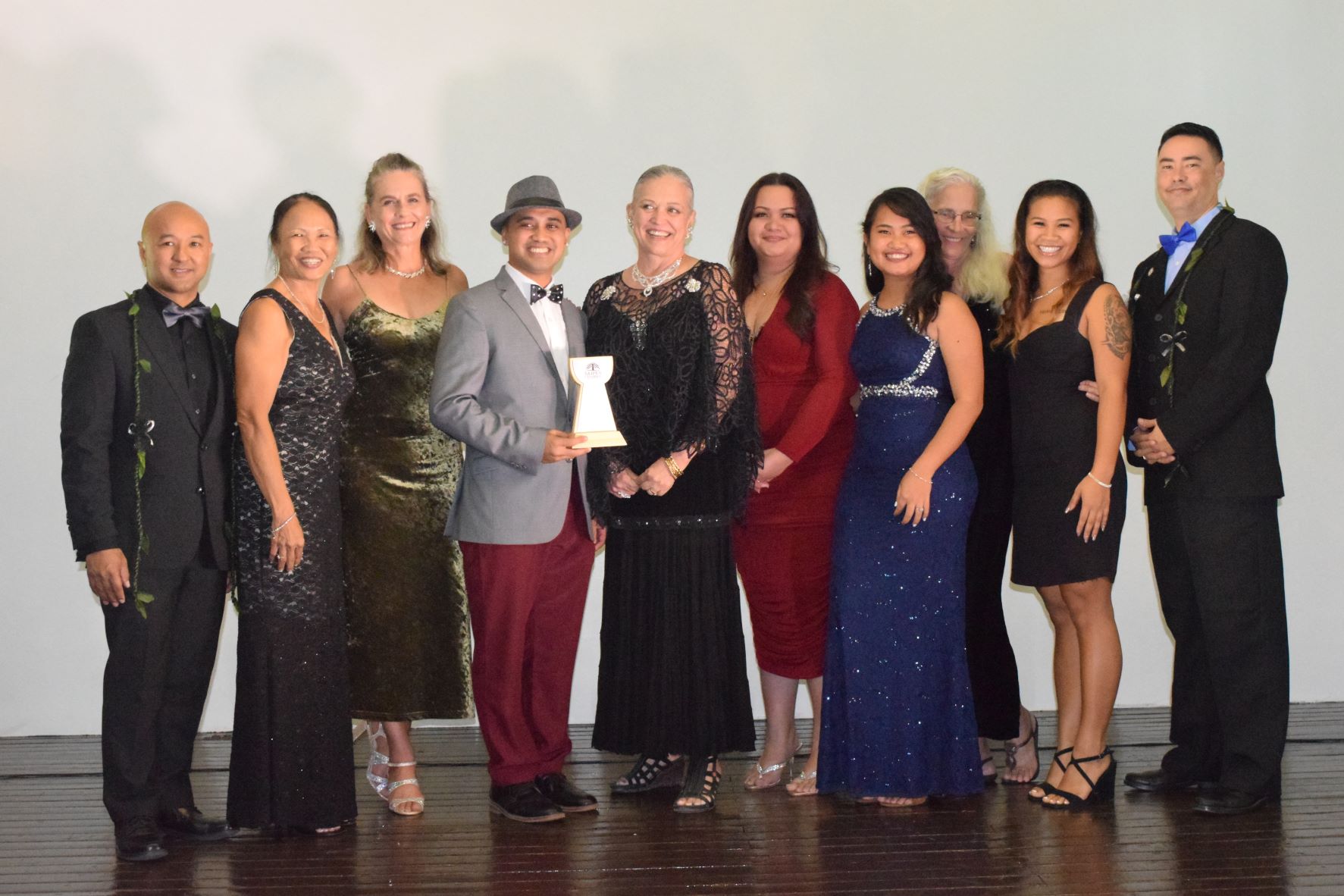 Saipan Chamber of Commerce President Joe Guerero, left, and board member Dr. Joshua Wise, right, with the Marianas Alliance of Non-Government Organizations’  executive director Frances Sablan, development director Laurie Peterka, project director Franco Santos, interim operations director Emma Perez, training manager Shawna Babauta, program coordinator Angelika Narvaez, program assistants Shawn Davis and Devine Pua.