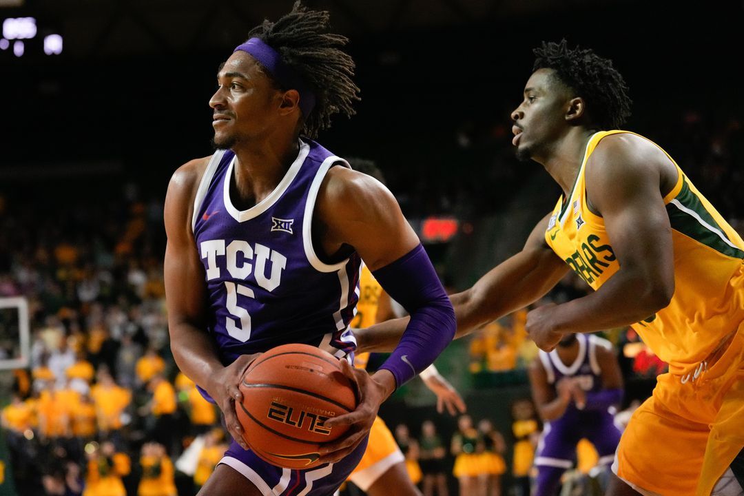 TCU Horned Frogs forward Chuck O'Bannon Jr. (5) drives to the basket past Baylor Bears guard Adam Flagler (10) during the first half at Ferrell Center in Waco, Texas, Jan. 4, 2023.