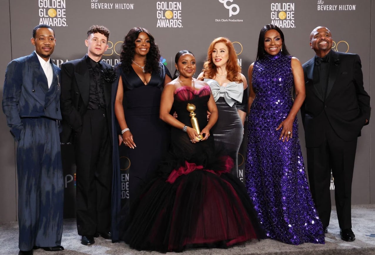 Quinta Brunson poses with cast members while holding the award for Best Musical/Comedy Series for "Abbott Elementary" at the 80th Annual Golden Globe Awards in Beverly Hills, California, Jan. 10, 2023.