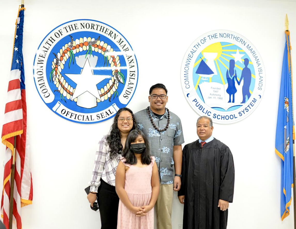 Board of Education Vice Chairman L. Antonio Borja with his wife, Star Taitano Borja, daughter Aurora Dawson Taitano Borja, and Supreme Court Justice Perry Inos.