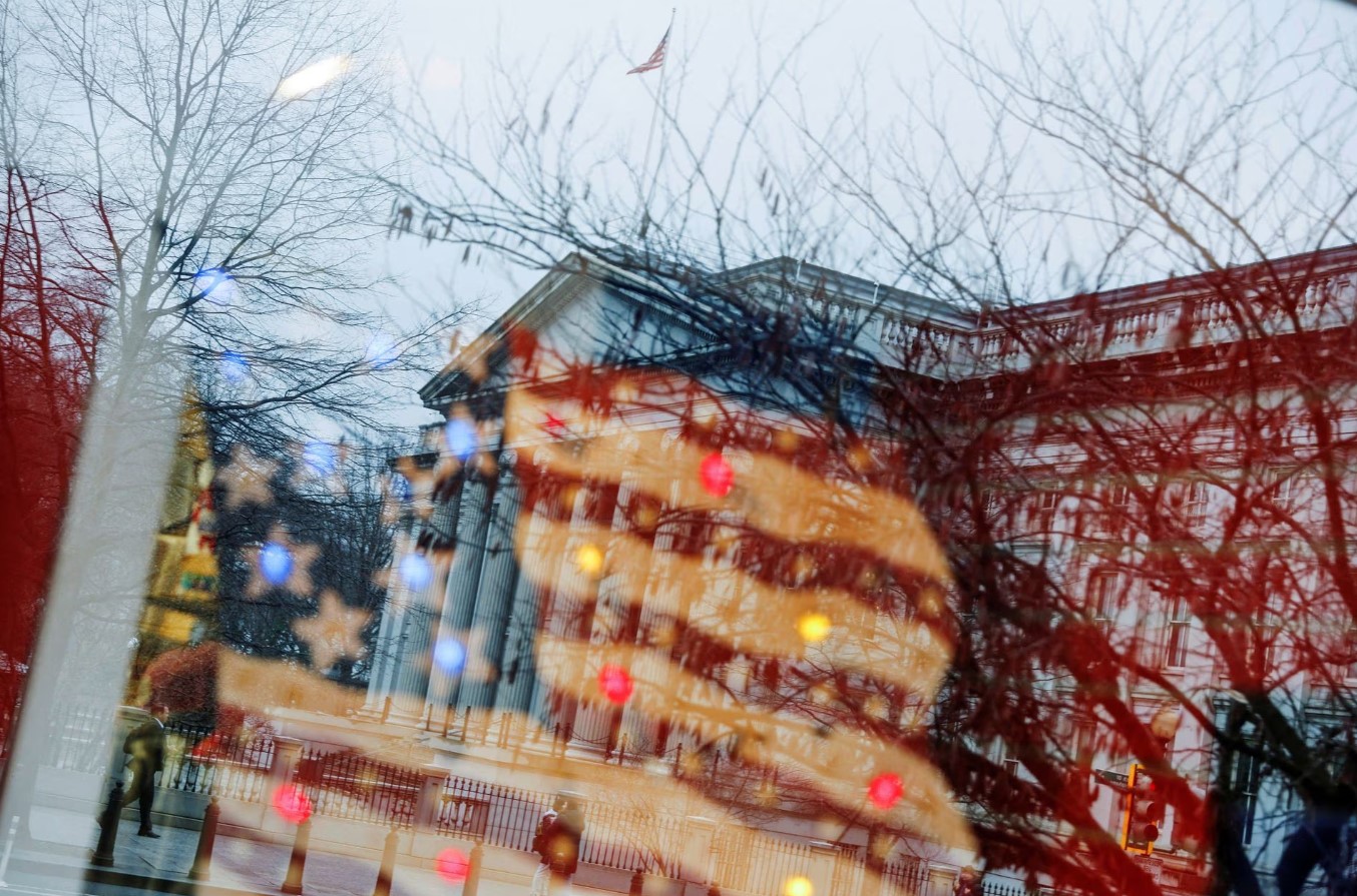 The U.S. Treasury building is reflected in the window of a souvenir shop, as the federal government hit its $31.4 trillion borrowing limit amid a standoff between the Republican-controlled House of Representatives, President Joe Biden and Democratic legislators that could lead to a fiscal crisis in a few months, in Washington, D.C. on Jan. 19, 2023.