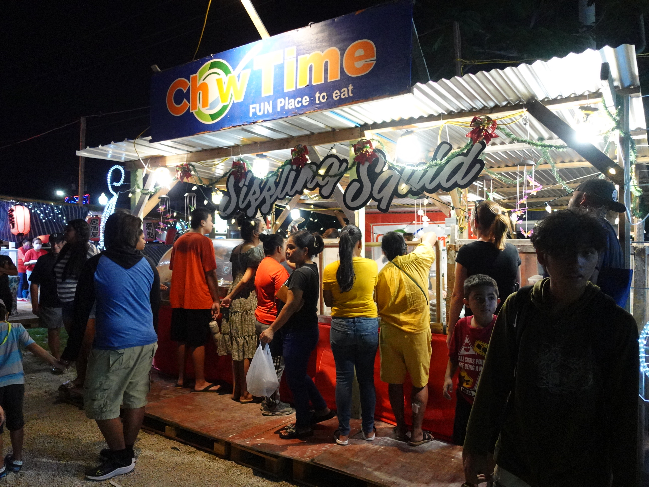 Chow Time serves patrons at the 18th Annual Christmas in the Marianas celebration on Dec. 3, 2022, at Garapan Fishing Base, Saipan.   The annual signature event of the Marianas Visitors Authority will return for its final night and New Year’s celebration on Jan. 7, 2023.