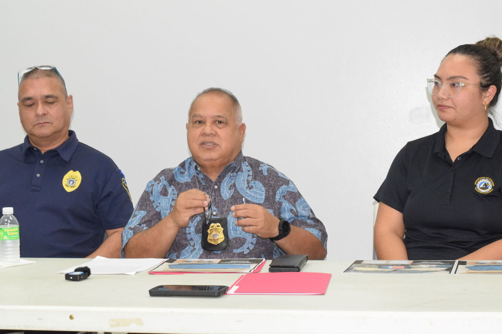 Division of Customs and Biosecurity Director Jose Mafnas, center, speaks to the media as Assistant Chief of Police Lawrence Camacho, left, and acting Finance Secretary Tracy B. Norita listen during a press conference at the Customs office in Puerto Rico on Monday.