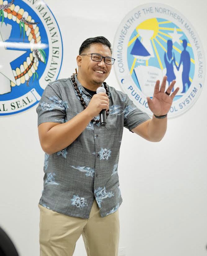 Board of Education Vice Chairman Antonio Borja smiles as he makes a point while delivering his remarks.