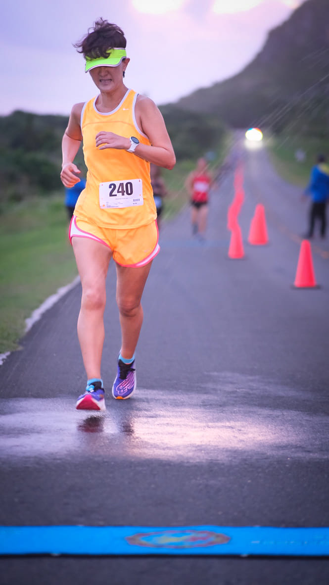 Ann Bang heads to the finish line of Run From '22 on Saturday at the former Mariana Resort.