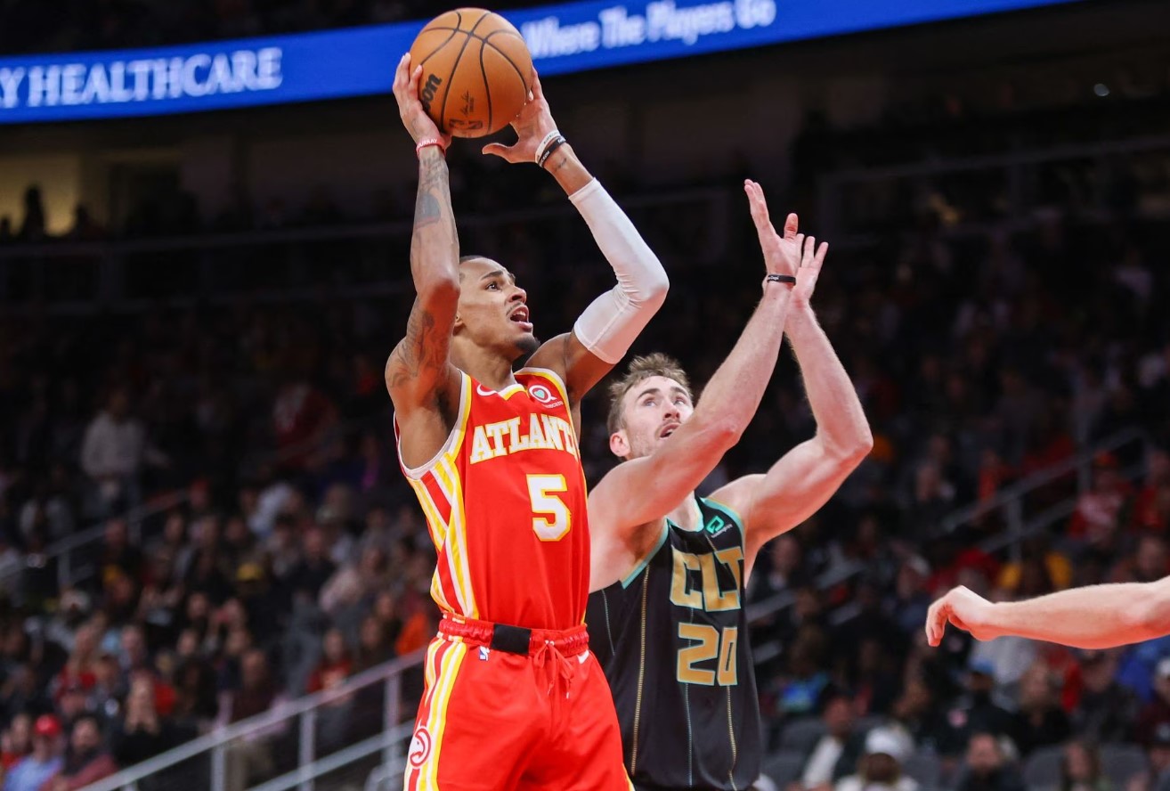 Atlanta Hawks guard Dejounte Murray (5) shoots against the Charlotte Hornets in the second half at State Farm Arena in Atlanta, Georgia on Jan. 21, 2023.