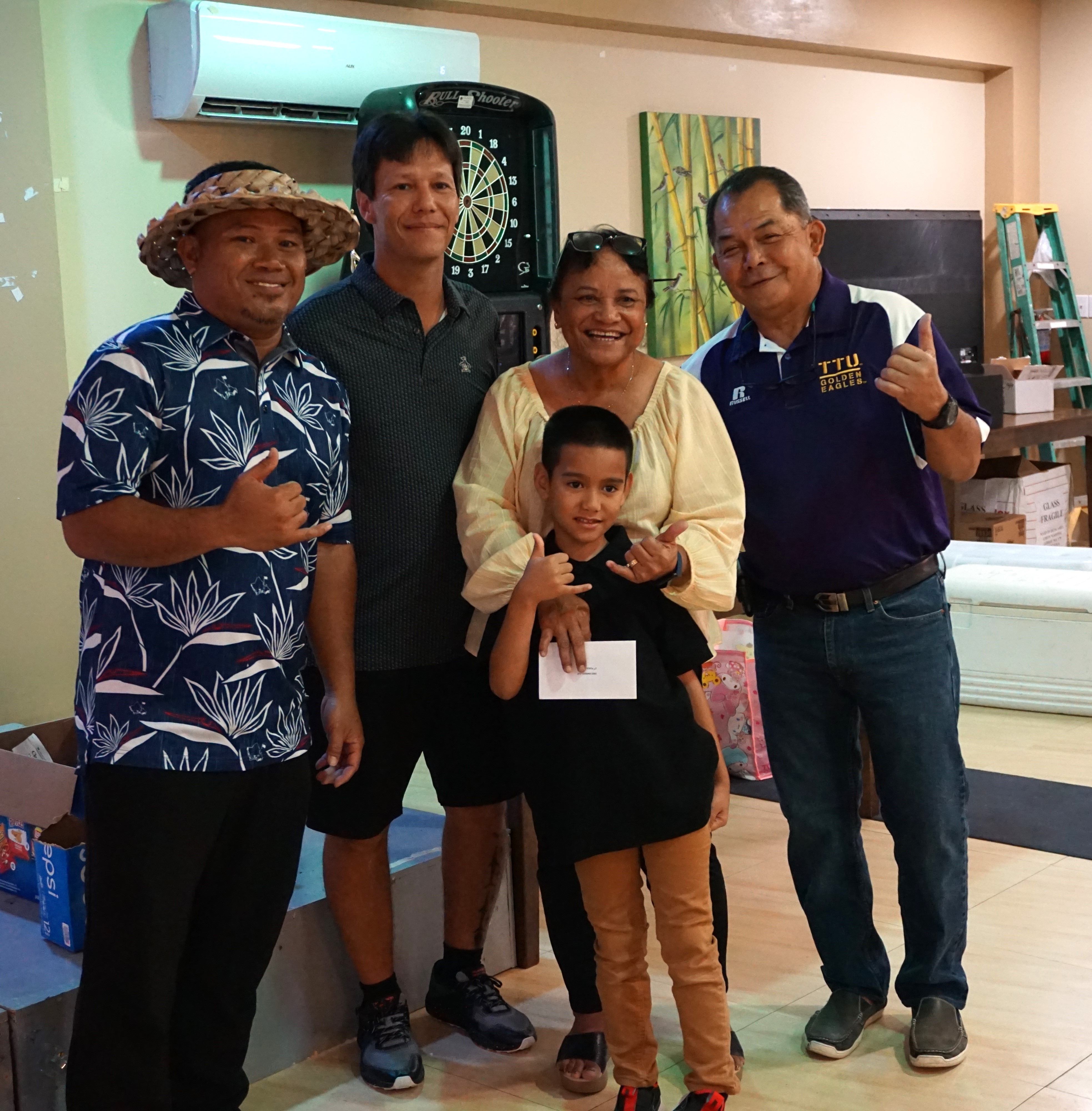 Amigos Cup winner Sherlyn Jones poses for a photo with Fred Salavaria, Peter "Dung" Tenorio and Amigos Golf Club President Joe Torres during the awards banquet Friday at the Rendezvous Restaurant of Saipan Vegas.