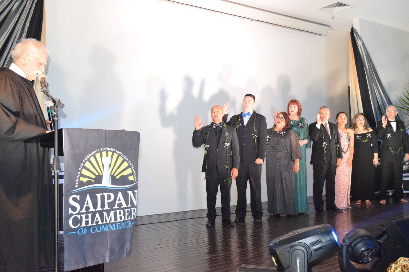Judge Kenneth Govendo, left, swears in the 2023 Saipan Chamber of  Commerce board members: Joe Guerrero, president; Dr. Joshua Wise, vice president; Janice Tenorio, treasurer; Donna Krum, secretary; Alex Sablan, director; Velma Palacios, director; Nicole Babauta, director; and Ron Smith, director.