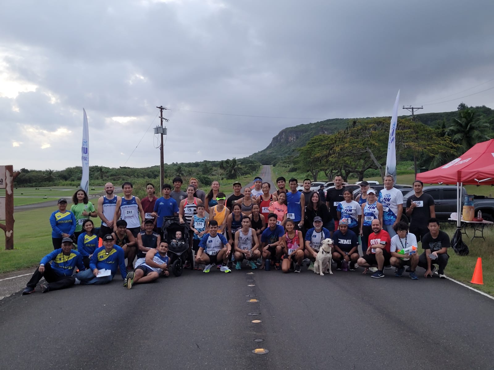 Run From '22 participants pose for a photo at the former Mariana Resort on Saturday.