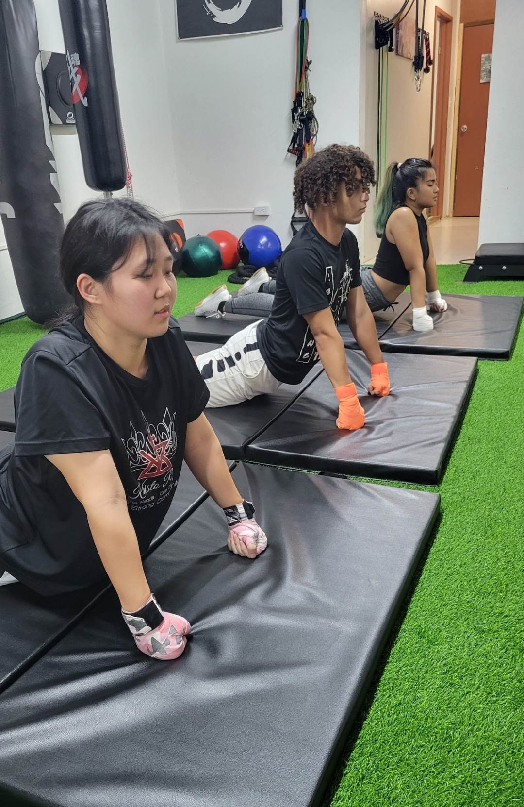 Kimy Kim, Masan Igisomar and Hana Diaz undergo strength and conditioning training at BBJ Athletics Studio.