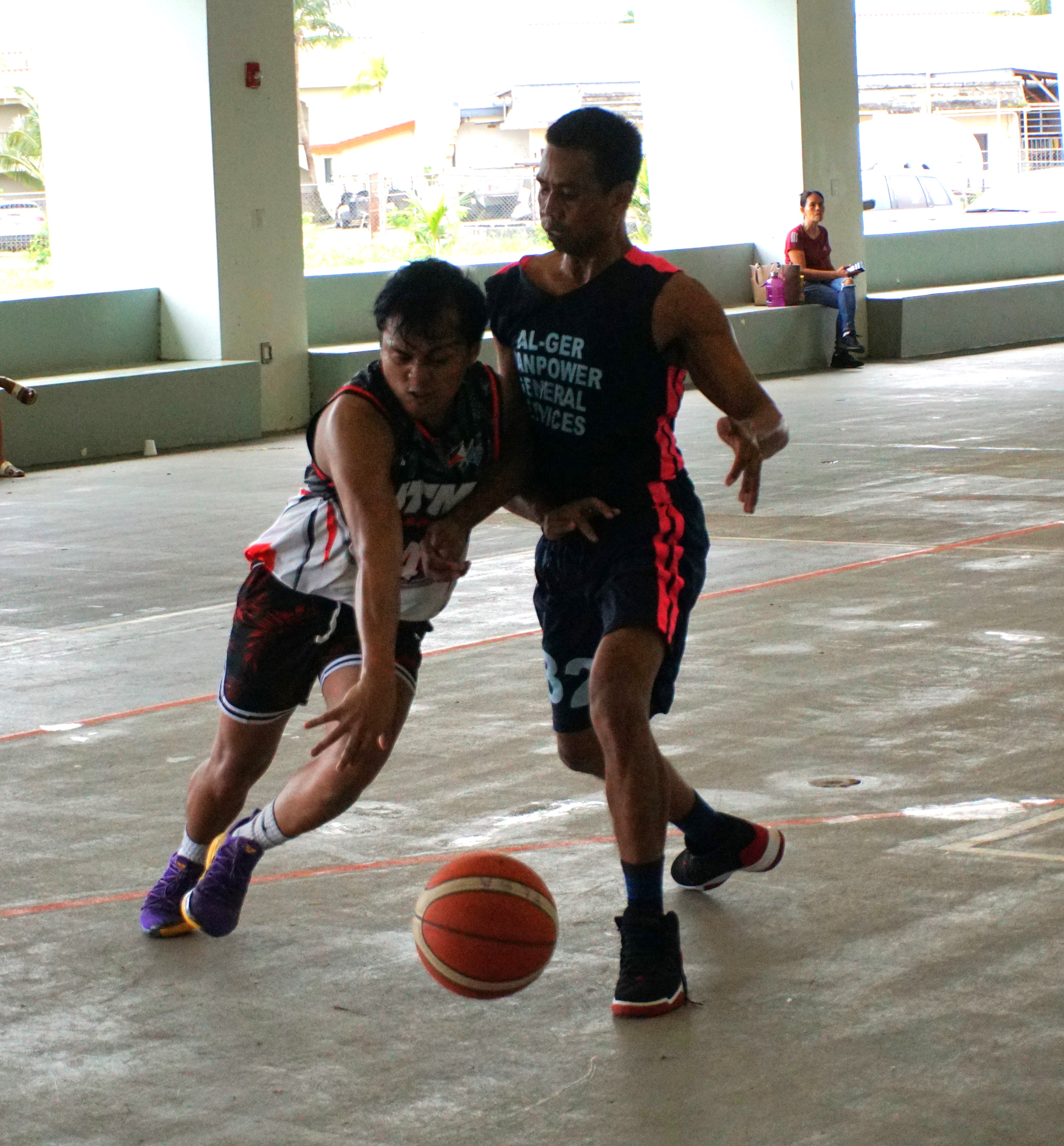 JTM Saipan's Joseph Torres beats a defender as he goes for the drive during an open division game of the Legends Sports Association Invitational Basketball League on Sunday at the Koblerville gym.