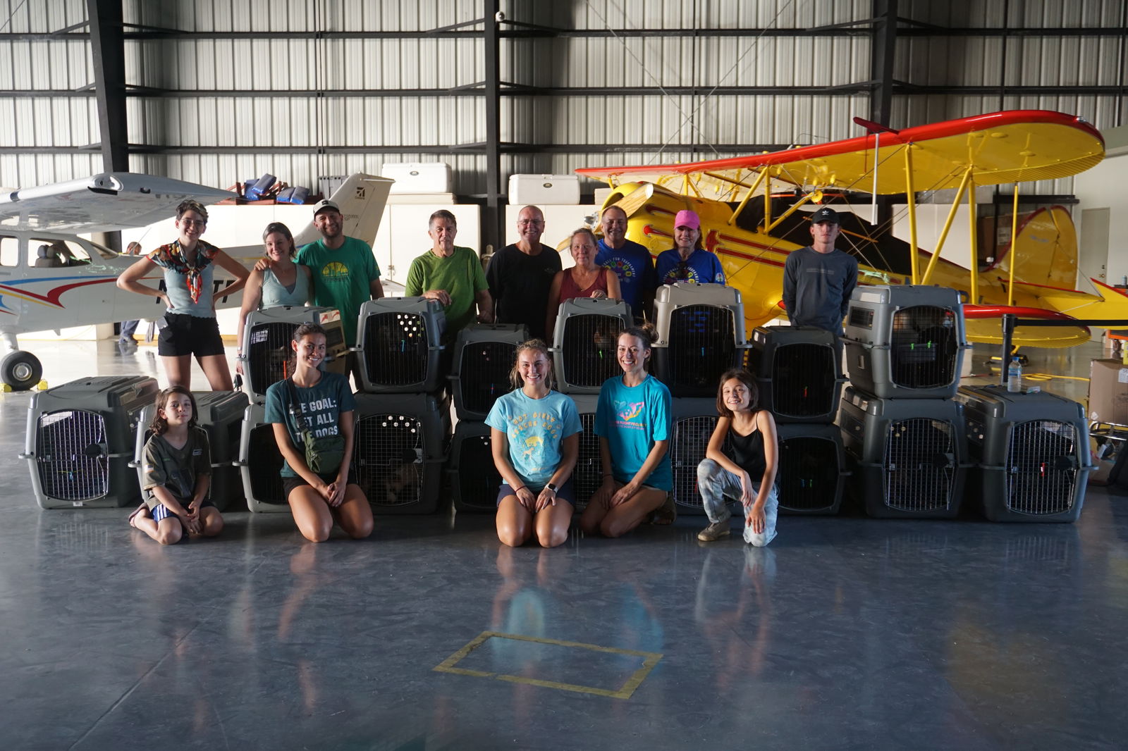 Front row, from left, Noah Lewis, Boonie Babies founders Aria Keilbach and Grace Keilbach, Boonie Flight Project founding partner Lauren Cabrera and volunteer Anya Lewis. Back row, from left, volunteers Victoria Sewell, Sarah Bergman-Lewis, Steve Lewis, Nicky Nichols and Saipan Pickleball team members Nelson Krum, Donna Krum, TJ and Lori Hill and Caden Church.
