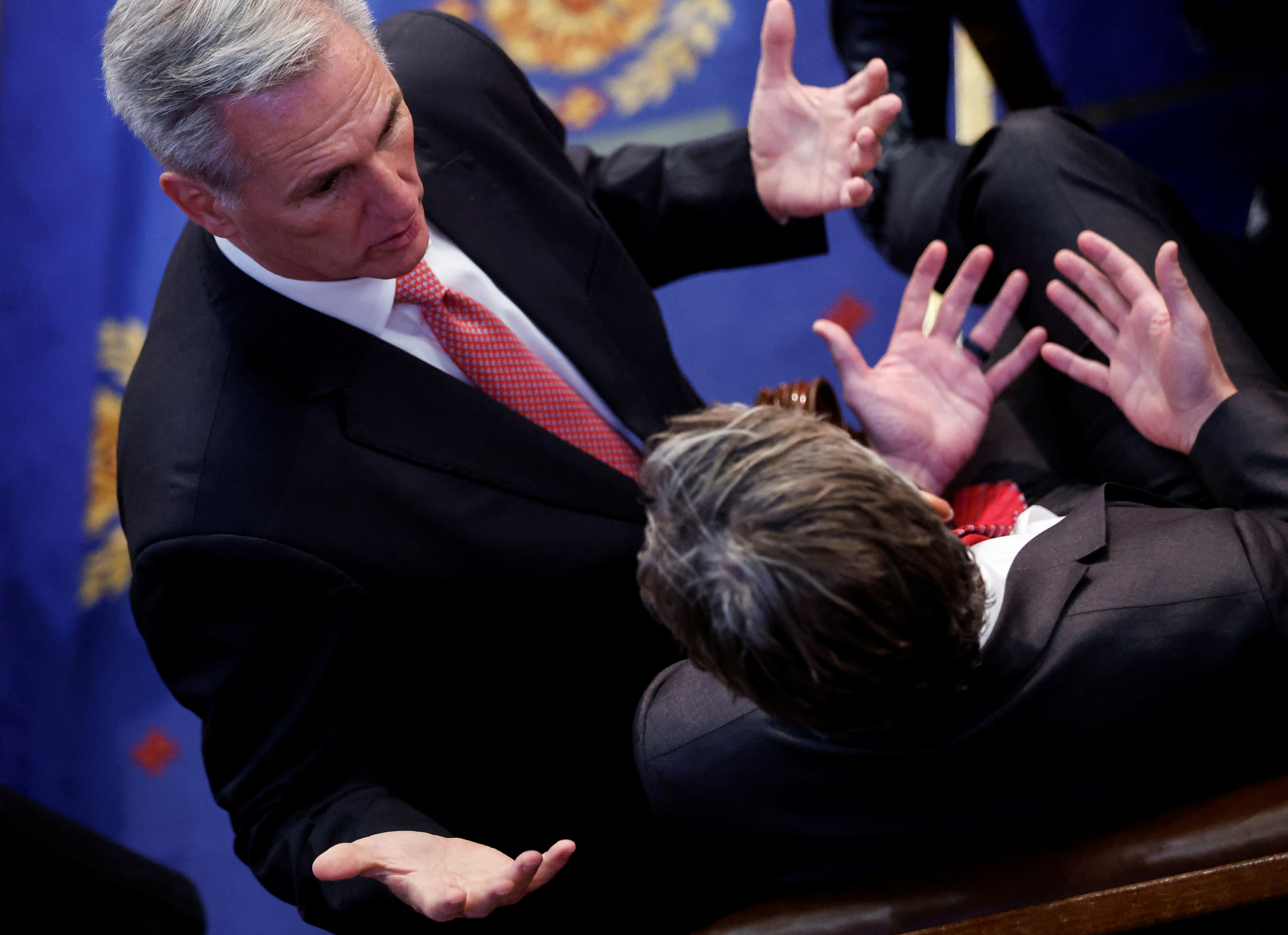 House Republican leader Kevin McCarthy speaks to U.S. Rep. Andy Ogles in the House chamber during voting for a new speaker on the third day of the 118th Congress at the U.S. Capitol in Washington, D.C., Jan. 5, 2023.